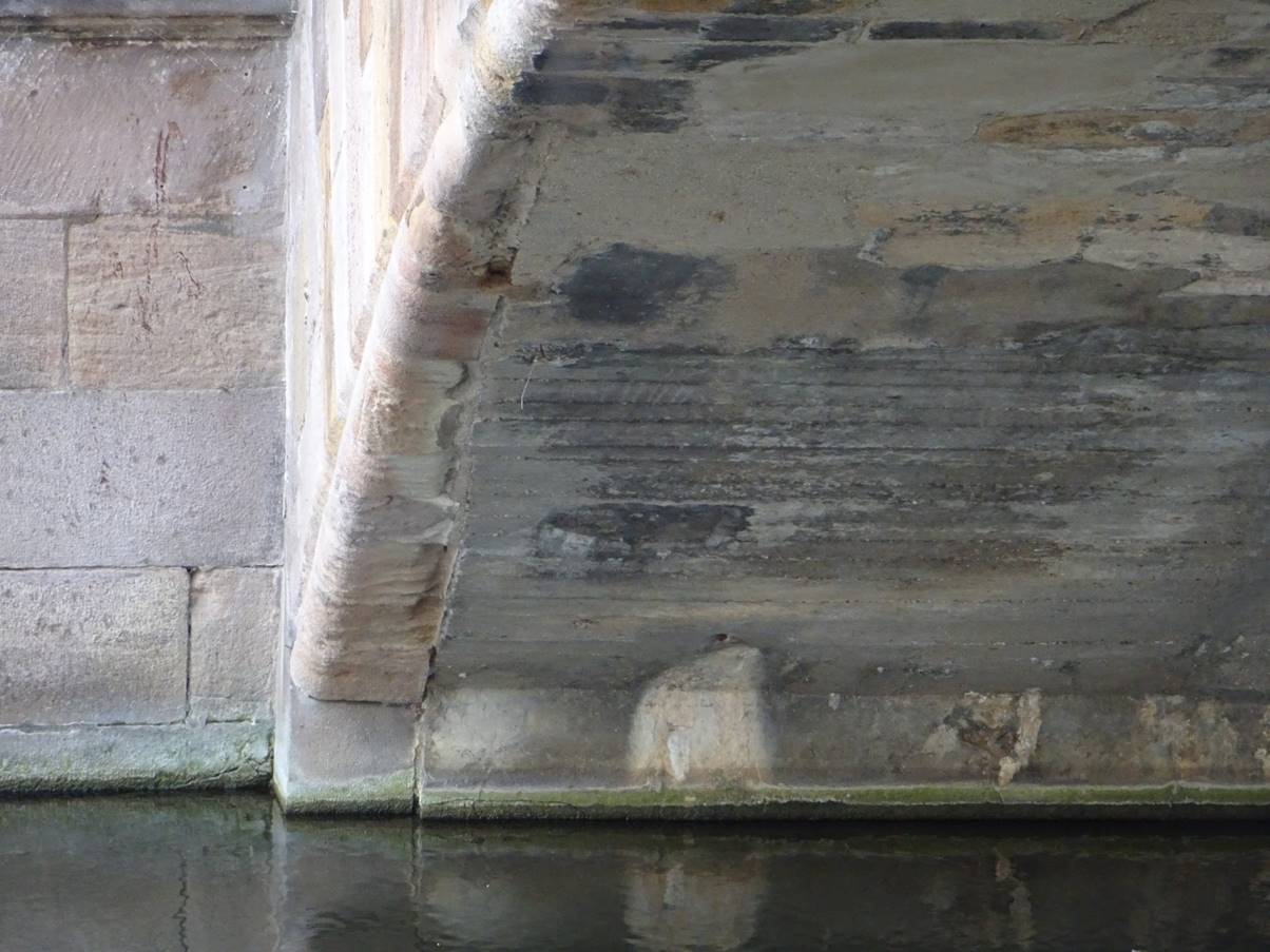 Is that concrete I see before me? What’s that about. War damage, perhaps?