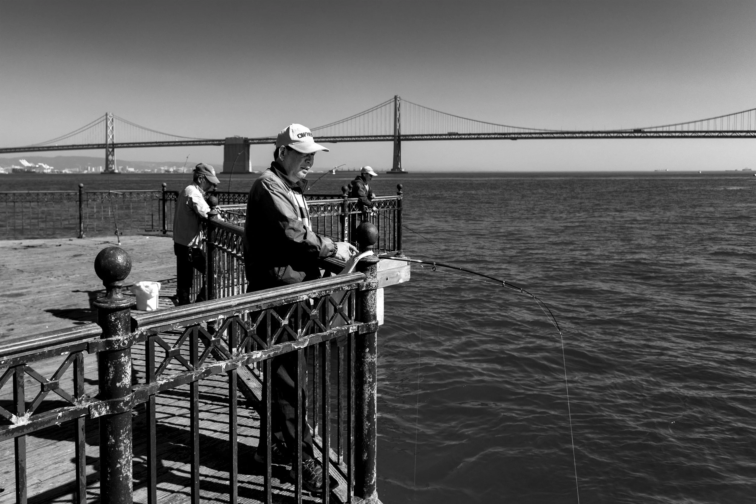 158_Scussel - Long Pier Fisherman B&W.jpg