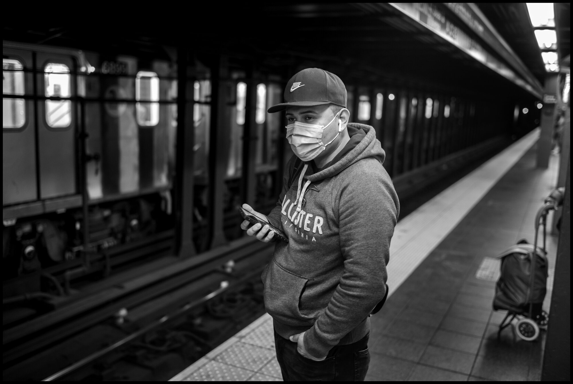  A man waits for a train at Times Square.  March 21, 2020. © Peter Turnley.  ID# 01-006 
