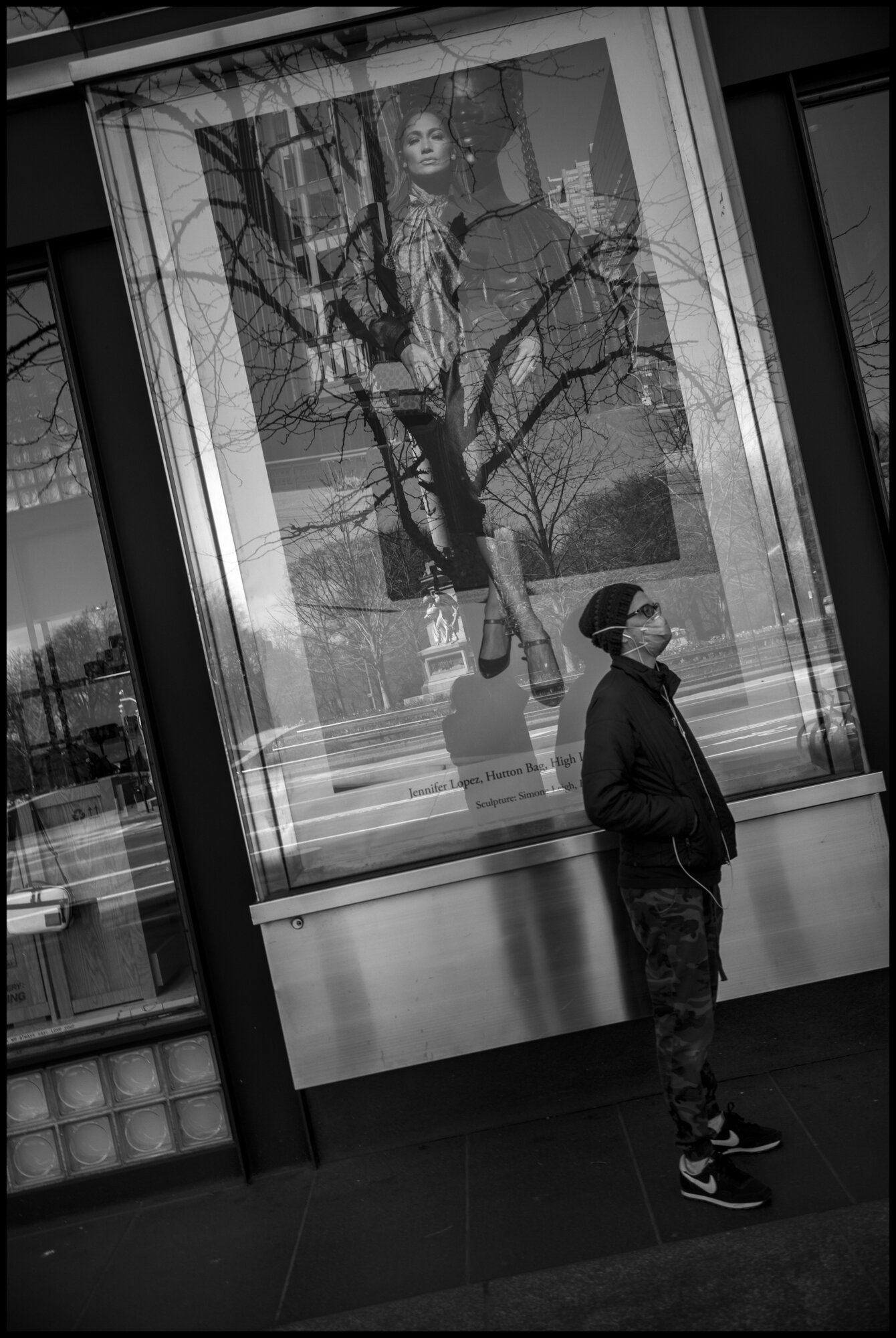 A man keeping social distance in line to enter the shopping mall at Columbus Circle.  March 21, 2020. © Peter Turnley.  ID# 01-013 