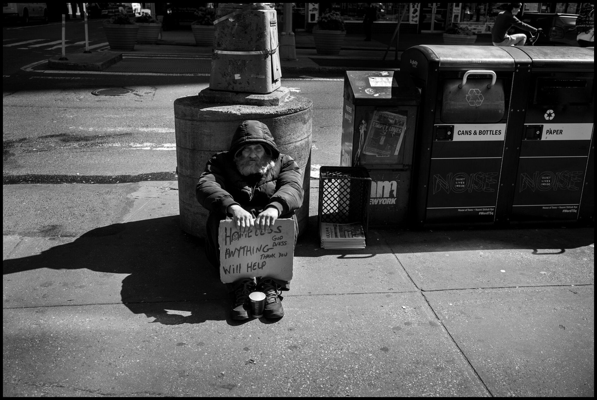  A homeless man sits near Times Square.  March 21, 2020. © Peter Turnley.  ID# 01-016 