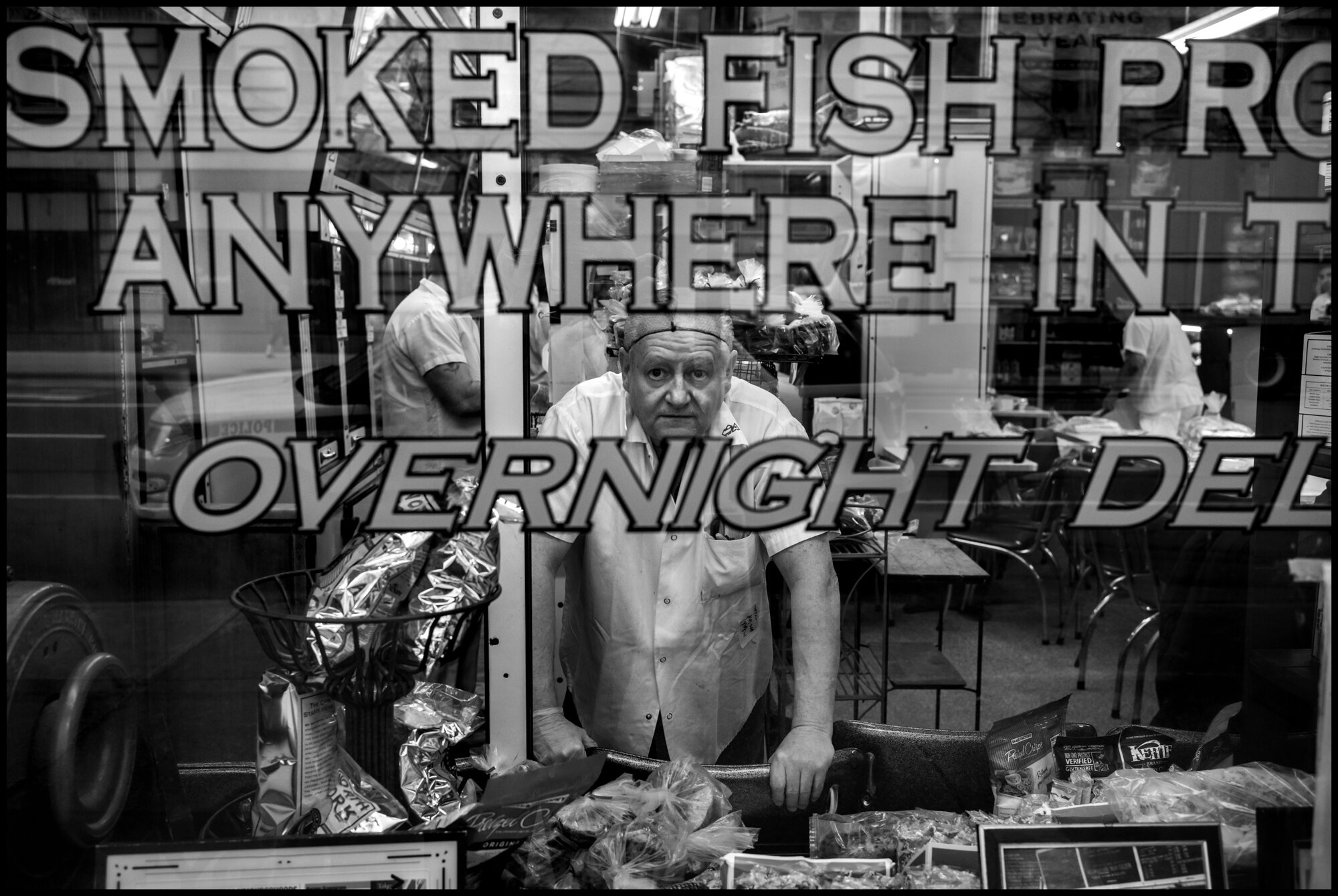  Joe who works at Barney Green Grass—The Sturgeon King, open for deliveries. Amsterdam Ave.  March 24, 2020. © Peter Turnley.  ID# 03-005 