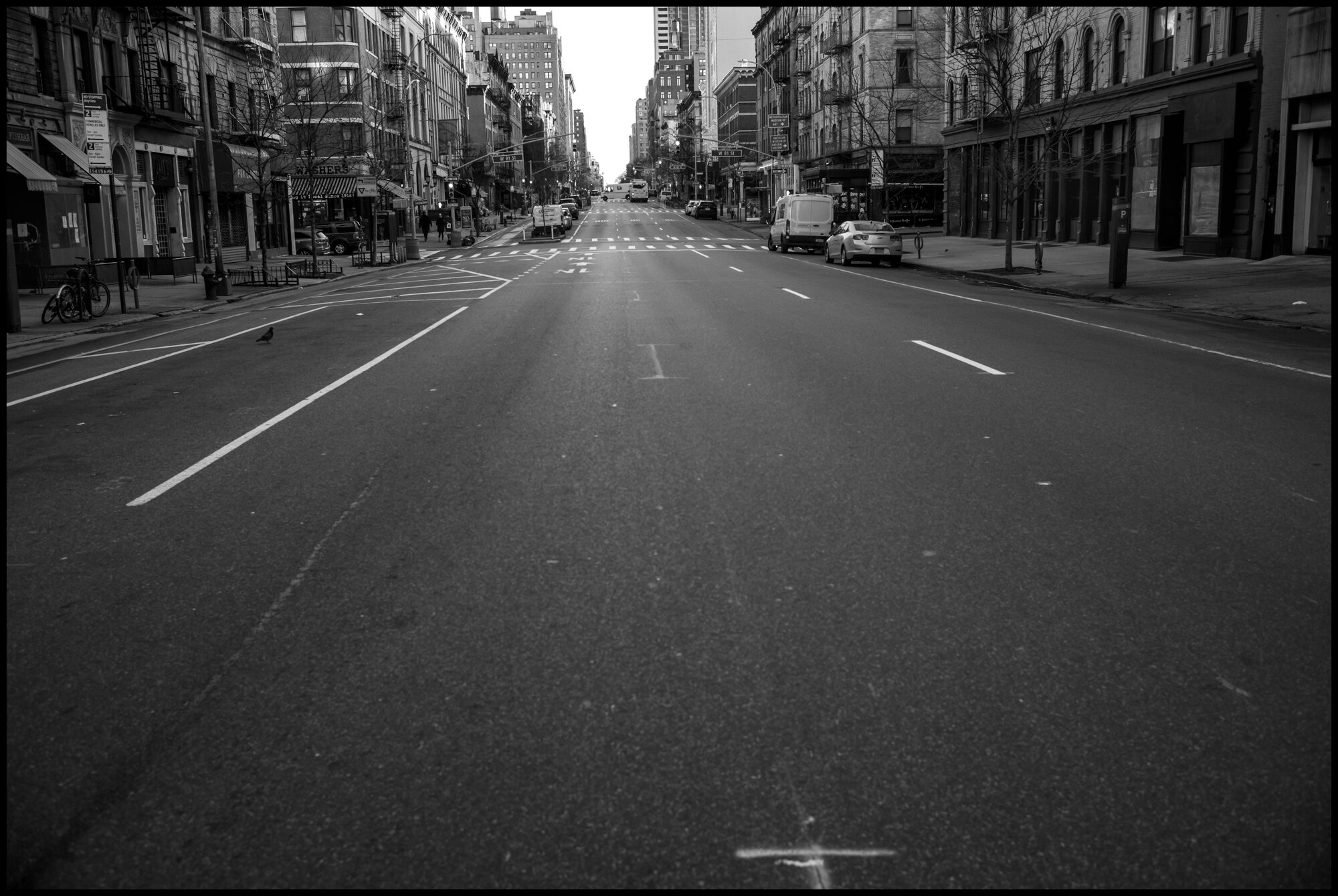  An empty street on Amsterdam Ave. on the Upper Westside. This photograph was made around 8am and usually is very full of traffic and activity on a week day.  March 24, 2020. © Peter Turnley.  ID# 03-009 