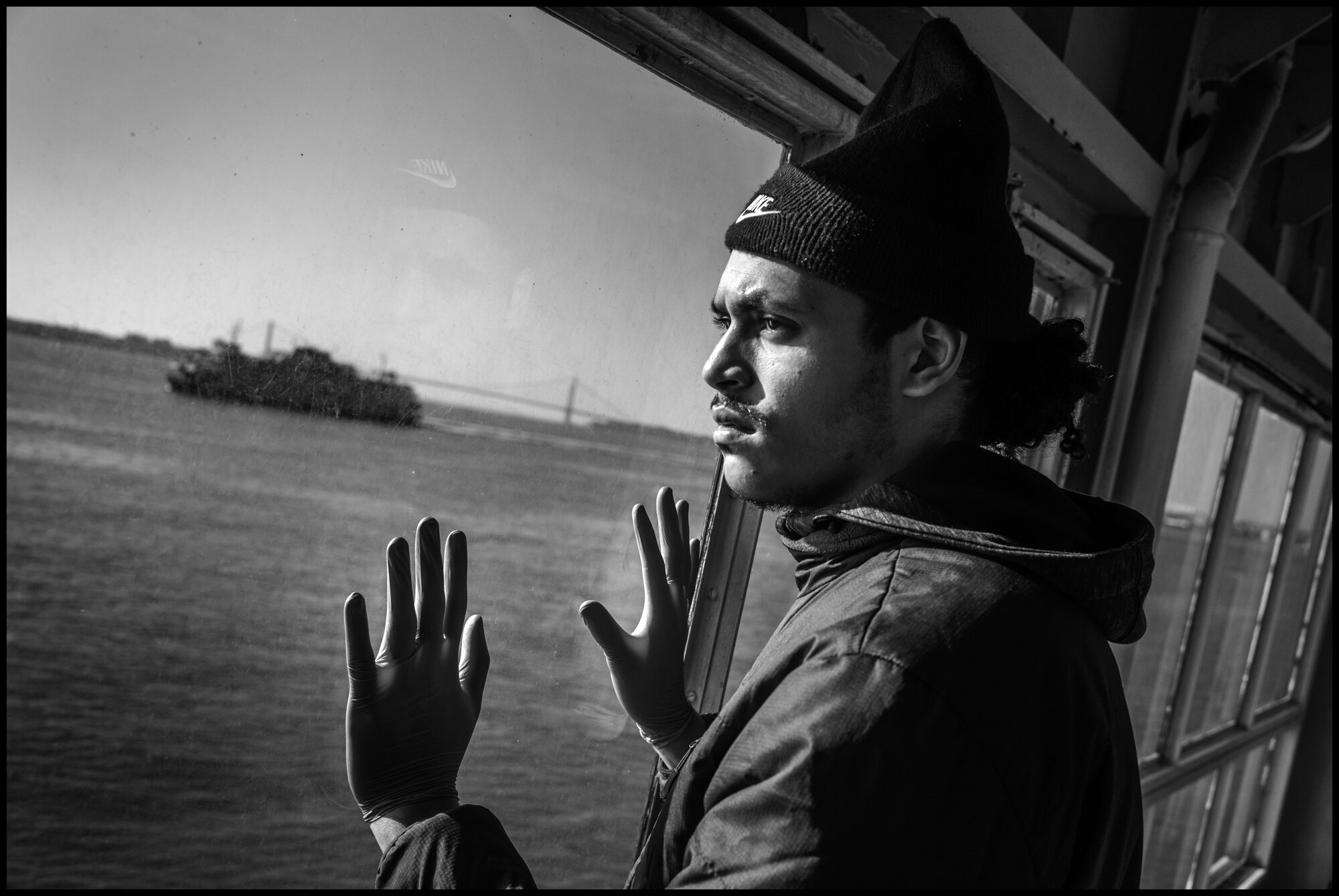  Pedro, 21, grew up in Spanish Harlem. He rides the Staten Island Ferry to visit his girlfriend. I asked him how he was doing and he told me, “It’s kind of rough-I was looking for a job, and this is not a good time.”  March 26, 2020 ©Peter Turnley  I