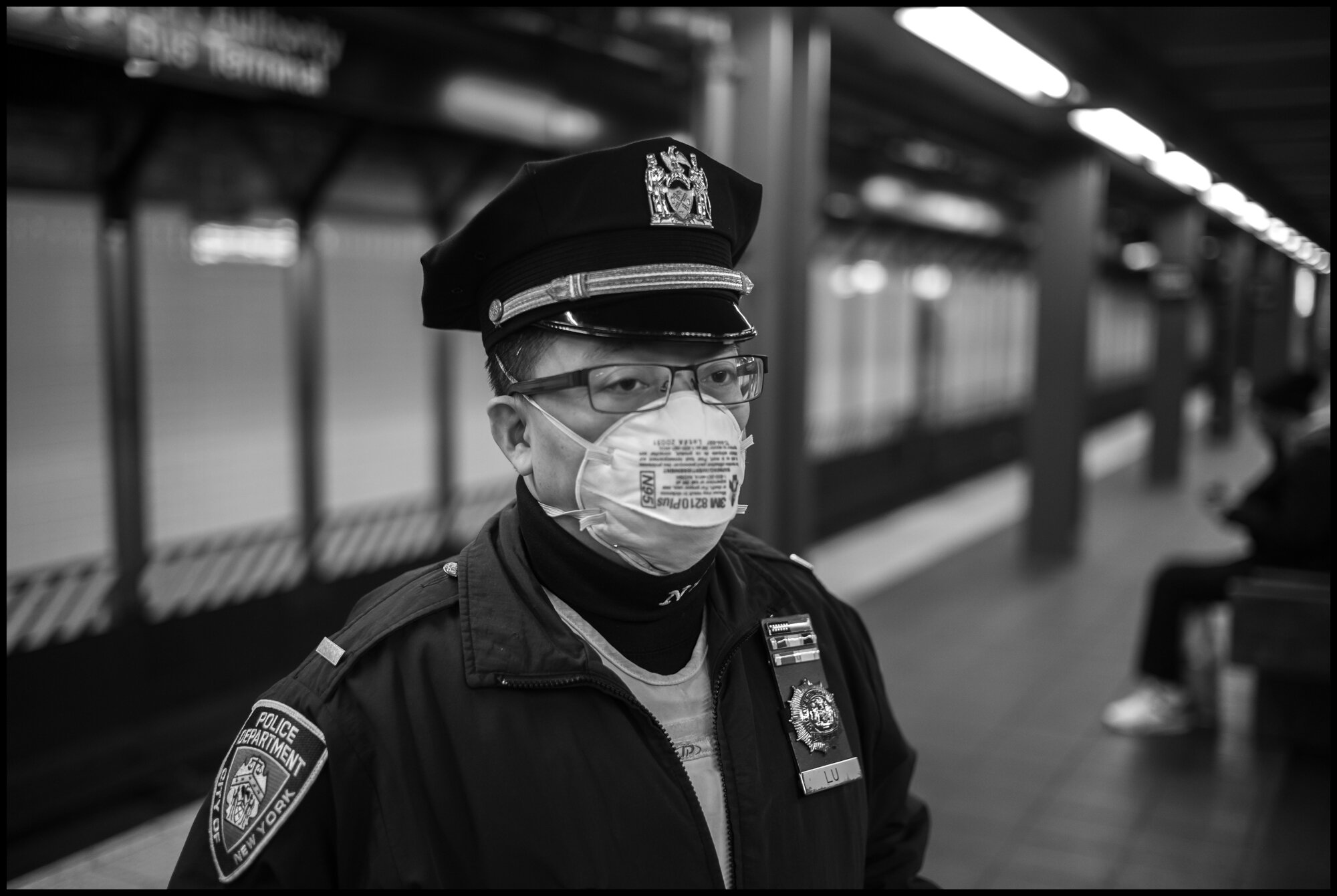  Lou, is a New York City policeman, stands patrol at the Grand Central Subway stop.  March 26, 2020 ©Peter Turnley  ID# 04-006 
