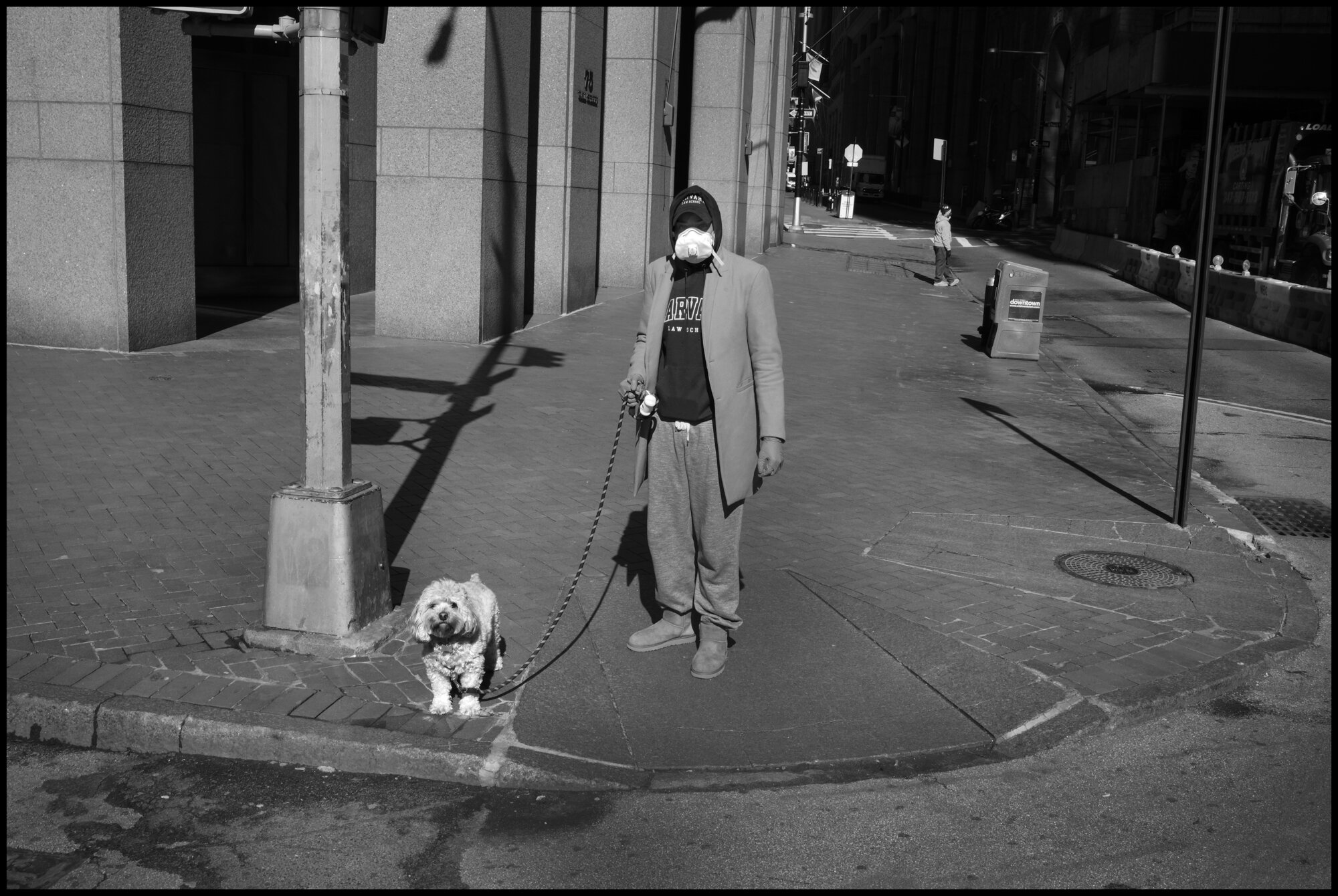  A man walks his dog on Wall Street.  March 26, 2020 ©Peter Turnley  ID# 04-010 