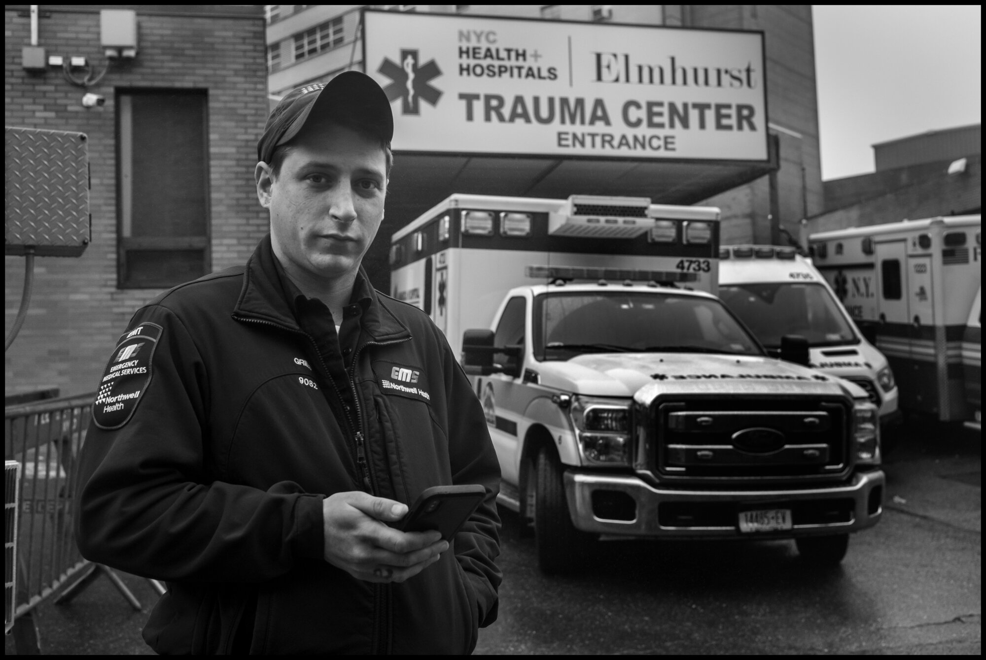  Ambulance Medic Ethan, at the back of the hospital where dozens of ambulances were lined up.   March 29, 2020. © Peter Turnley  ID# 07-003 