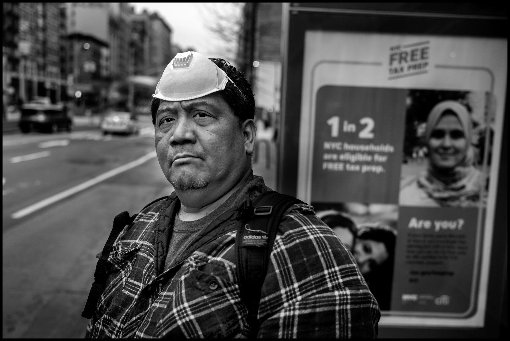  Joe, a doorman originally from Hawaii waits for the bus to take him home to Queens. I worked the all night shift ,and couldn’t take the train at the 96th street stop because he told me a train had caught on fire the night before and the fire killed 