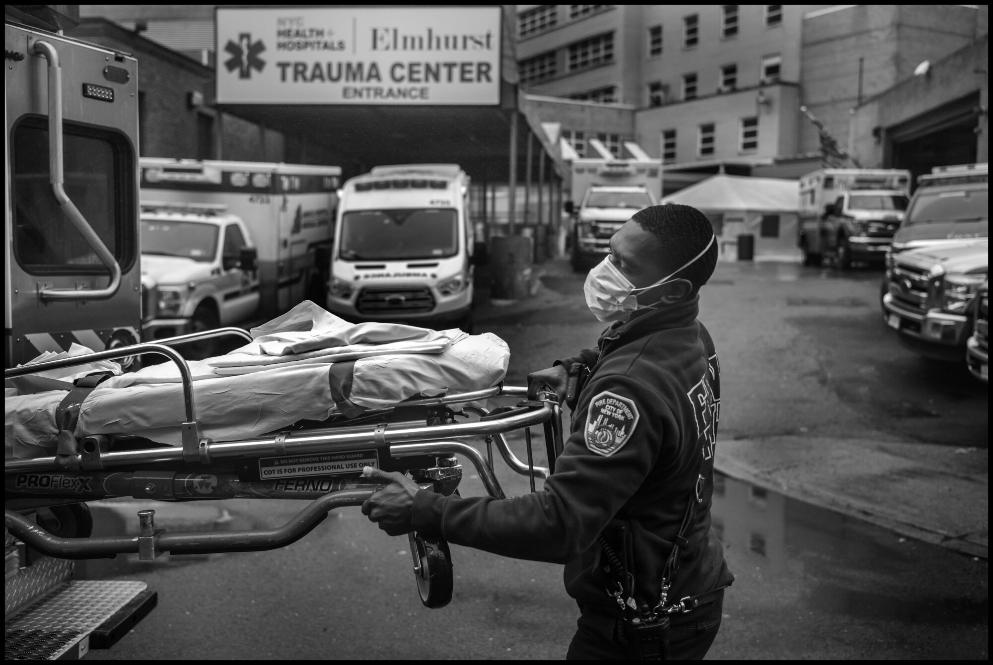  Fabrice, 28, an ambulance driver behind Elmhurst Hospital in Queens.  March 29, 2020. © Peter Turnley.  ID# 07-010 