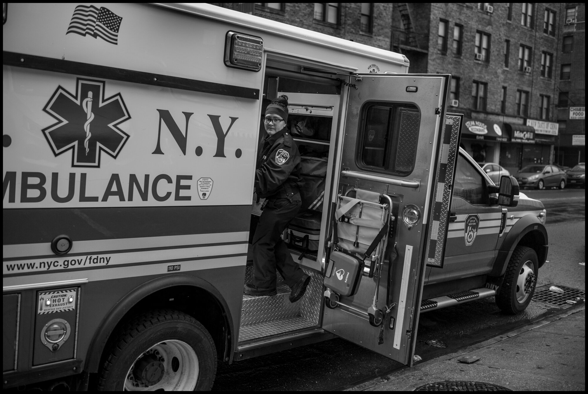  An ambulance behind the emergency room at Elmhurst Hospital in Queens.   March 29, 2020. © Peter Turnley  ID# 07-014 