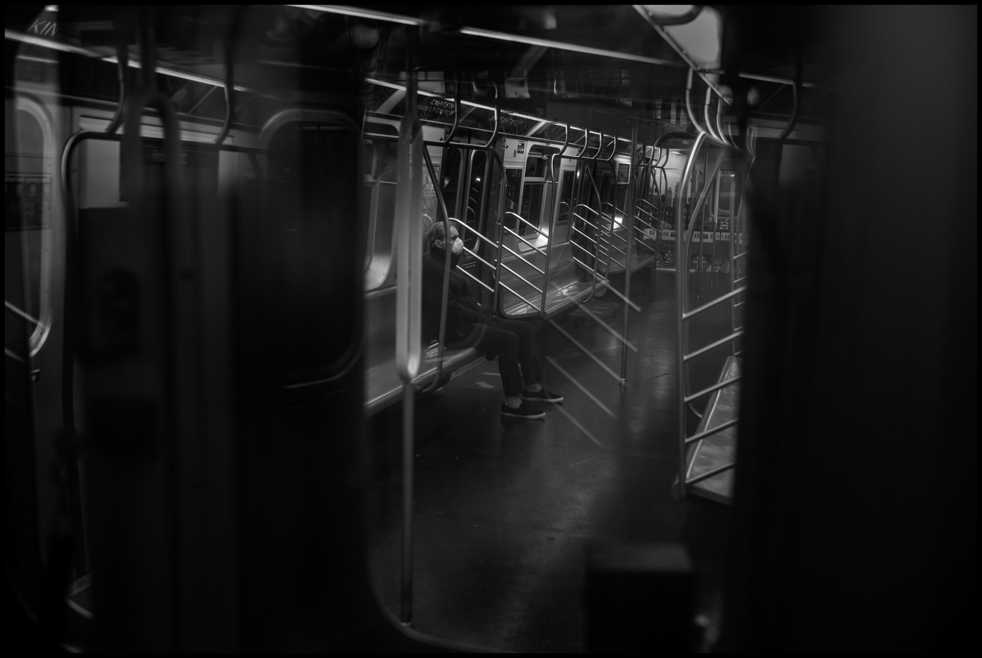  I am most scared when I need to be in a train. I always feel very lonely, and most often in the train, am alone. A train heads from Queens towards Manhattan.   March 29, 2020. © Peter Turnley  ID# 07-016 