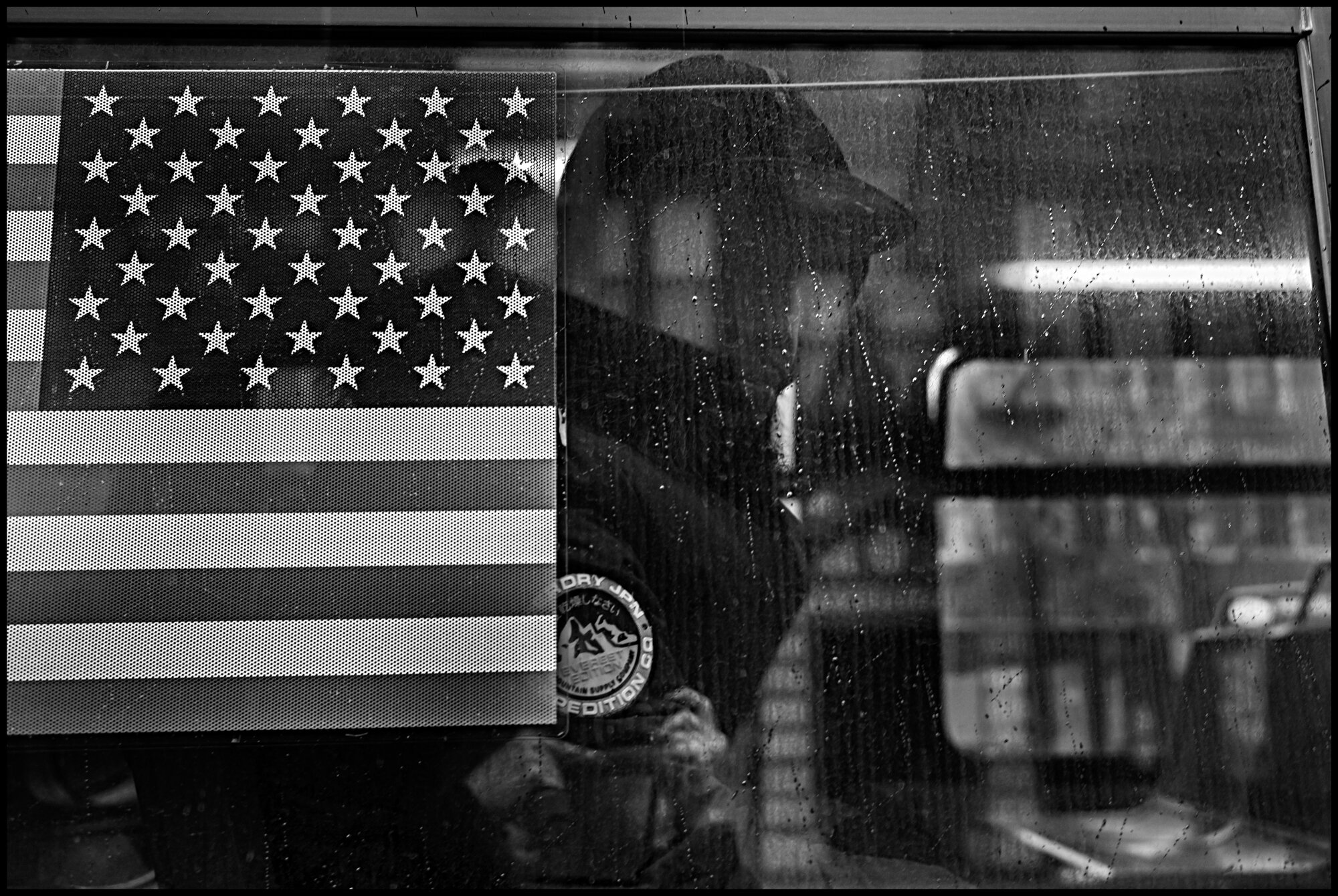  A bus and a passenger in Harlem.   March 28, 2020. © Peter Turnley.  ID# 06-014 