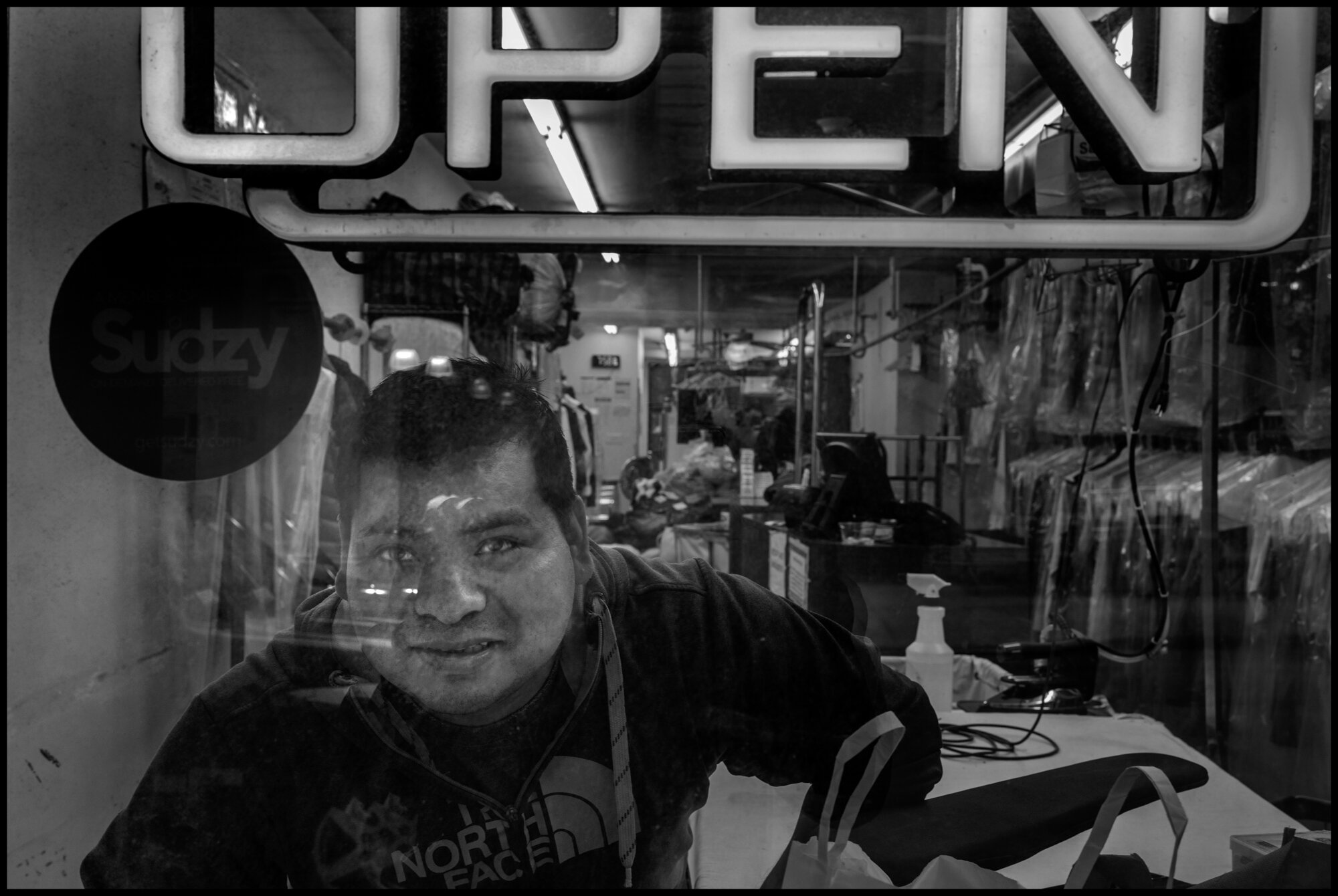  Lorenzo, 42, keeps business open at a laundry on 80th Street.   March 28, 2020. © Peter Turnley.  ID# 06-015 