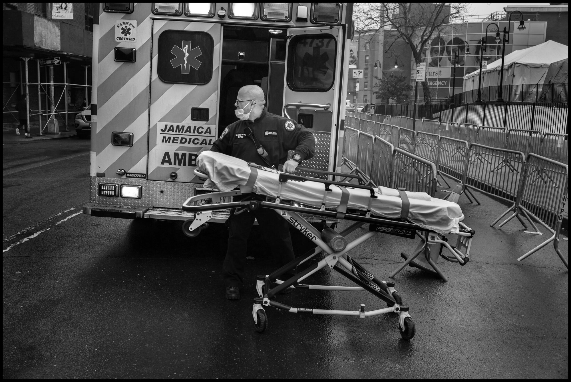  Mike Galloway,&nbsp;ambulance medic A working at the back of the hospital where dozens of ambulances were lined up.   March 29, 2020. © Peter Turnley.  ID# 09-002 