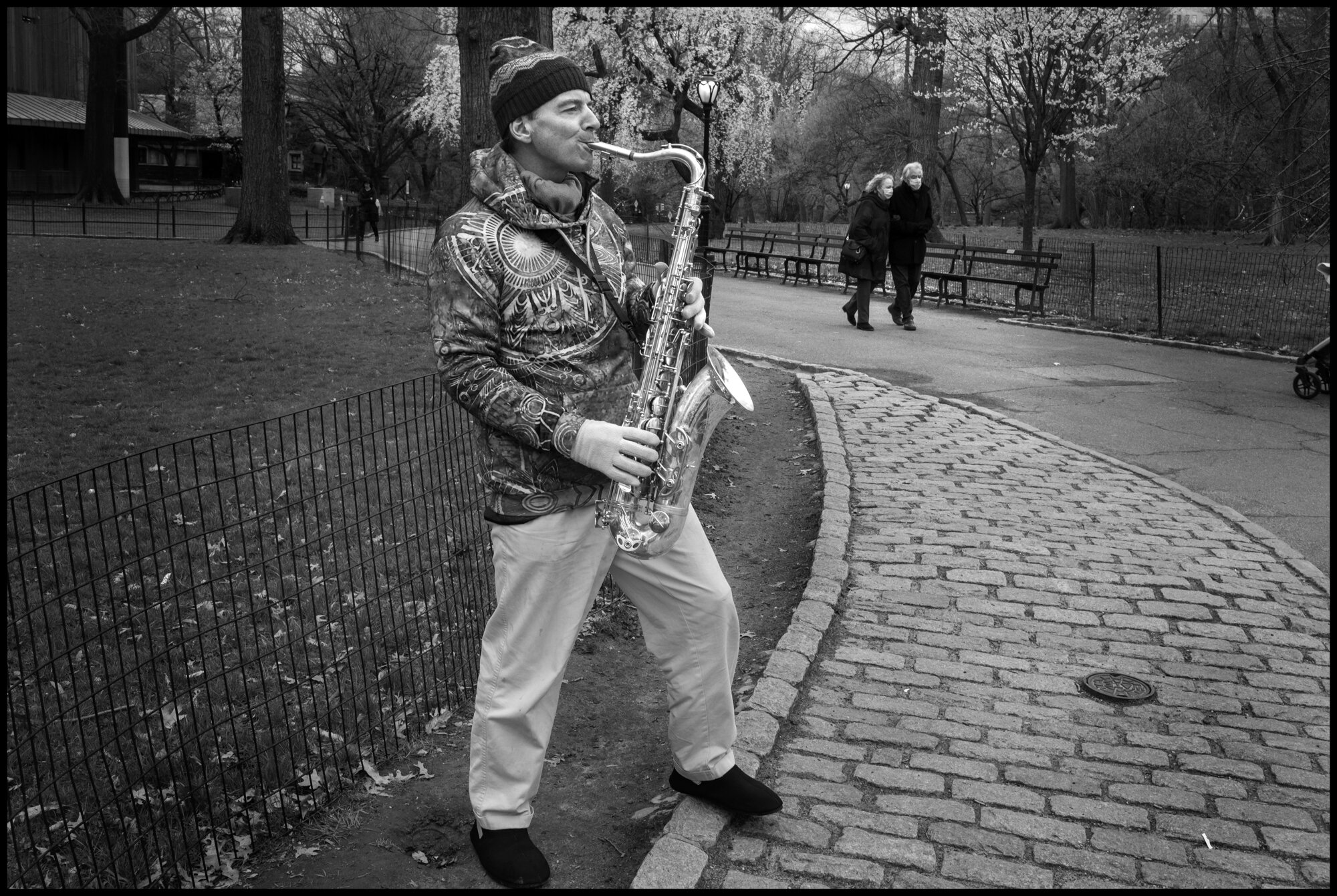  Martin, originally from Manchester, was playing the saxophone in the park.   March 31, 2020. ©Peter Turnley.  ID# 09-011 