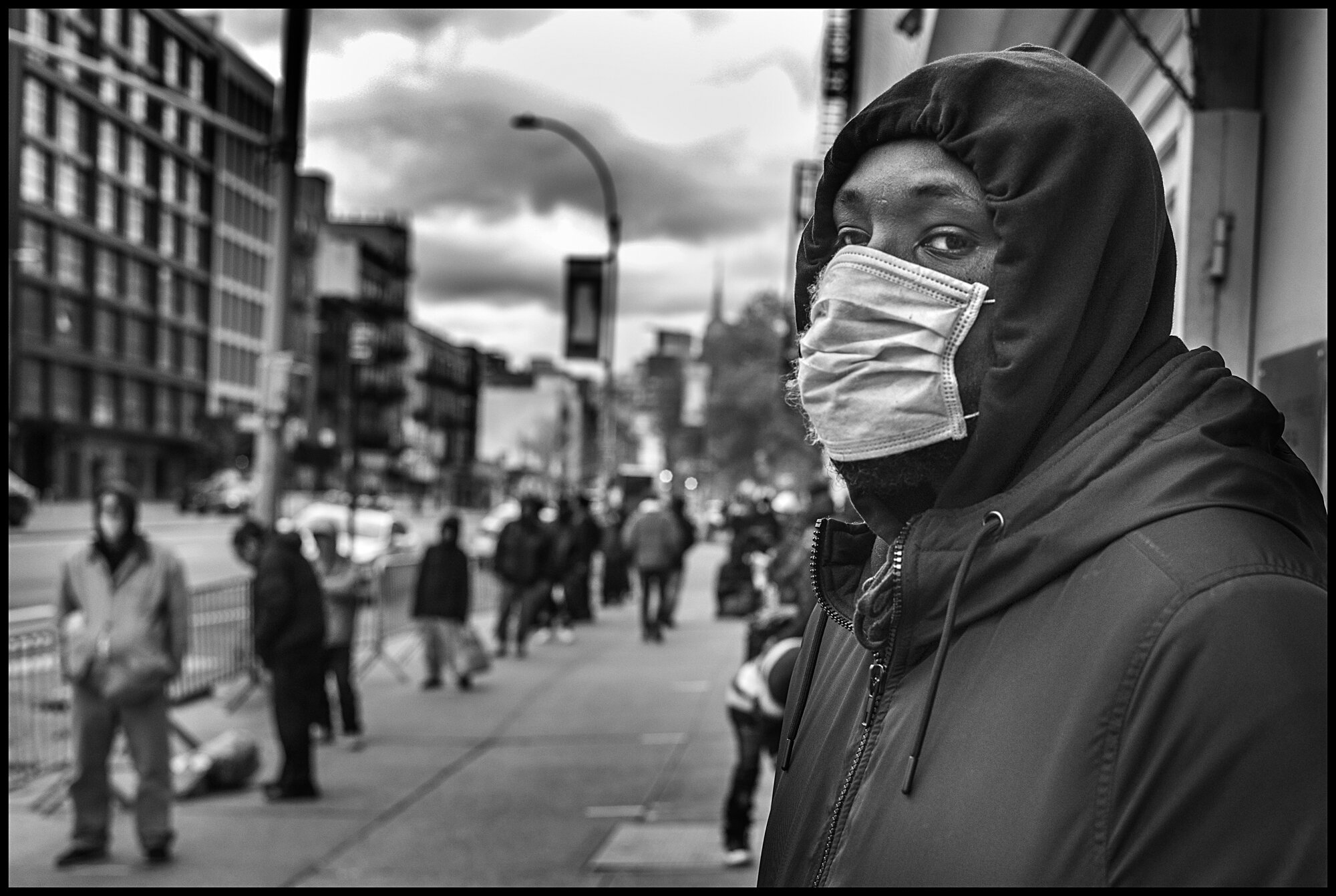  Carl, waits in line for food at a soup kitchen at The Bowery in New York City.   April 10, 2020. © Peter Turnley  ID# 18-001 