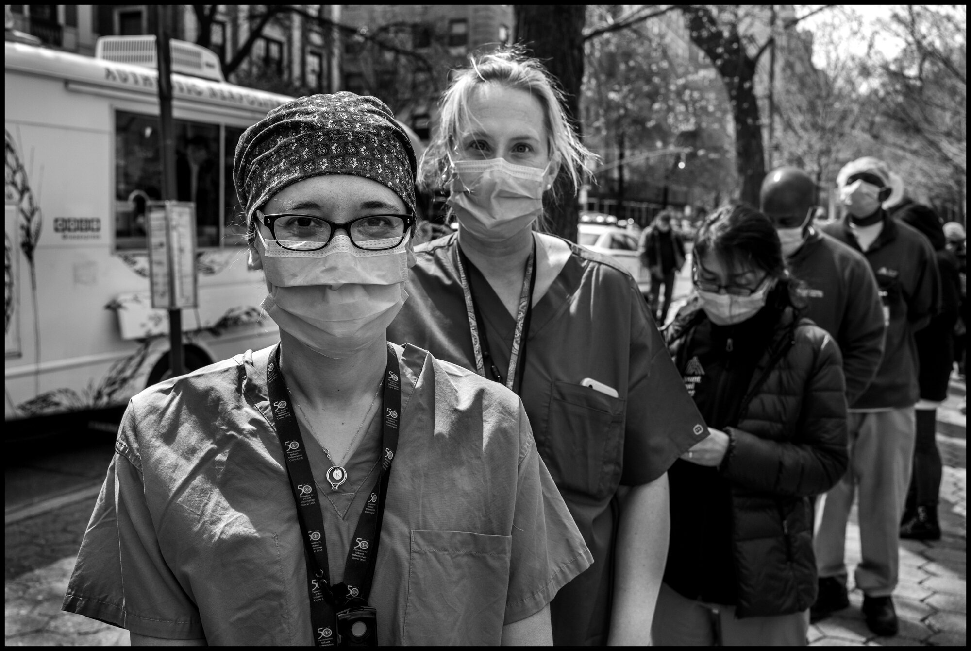  Katy and Jen are both doctors working in Pre-natal intensive care. “We deal with high risk deliveries. Some times we have patients that are delivering that have coronavirus. We are hanging in there.”  April 17, 2020. © Peter Turnley  ID# 23-008 