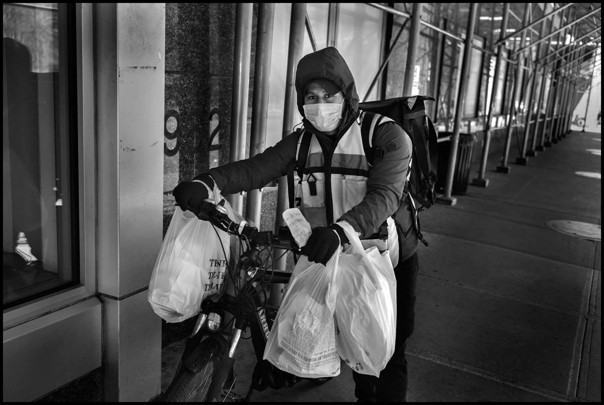  Julian 25 is a delivery messenger, originally from Guatemala.   April 19, 2020. © Peter Turnley  ID# 26-016 