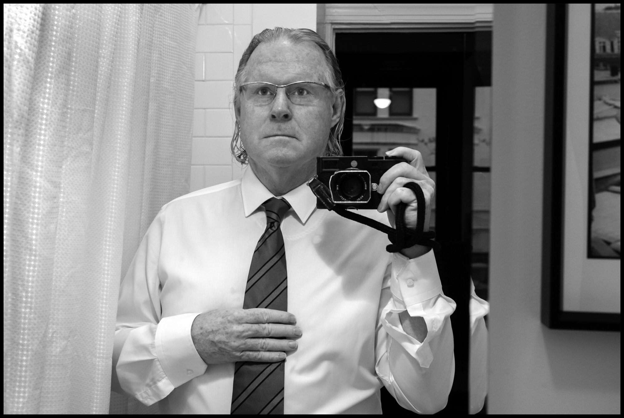  Self portrait. Peter Turnley, 6am, preparing to go to the funeral of Anthony, “Tony”, Thomas, a legendary New York Paramedic who died ofCovid-19 related causes, in Bay Ridge, Brookly, New York.   April 31, 2020. © Peter Turnley  ID#33-001 