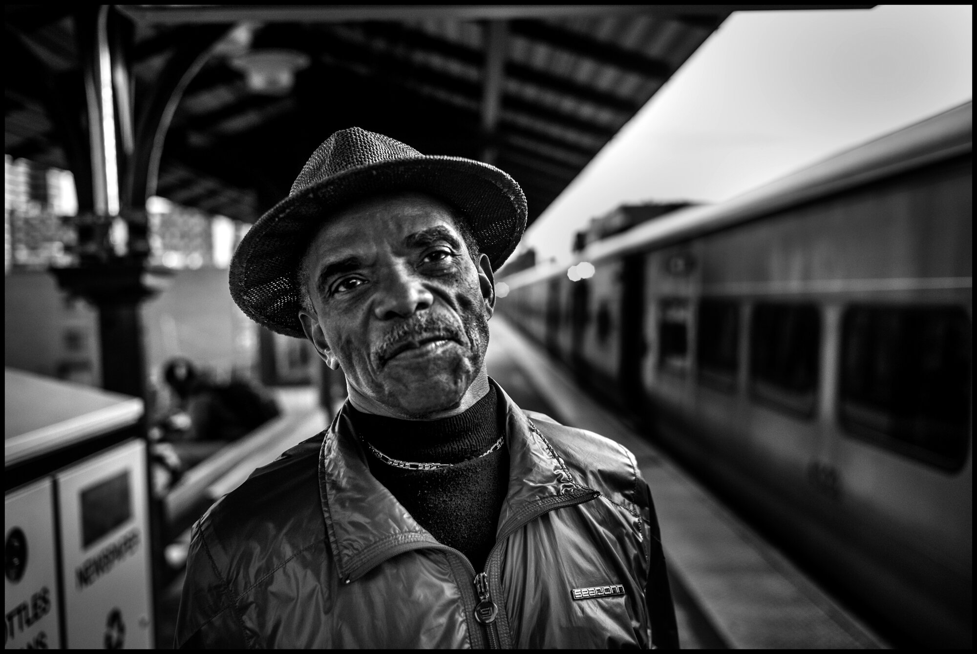  C. Marsh who told me he is a doctor, waits for a train home at the 125th Street train station in Harlem. I asked him who he felt about the situation, and he said, “please don’t aske me that-it’s been a really long day.”  March 24, 2020. © Peter Turn