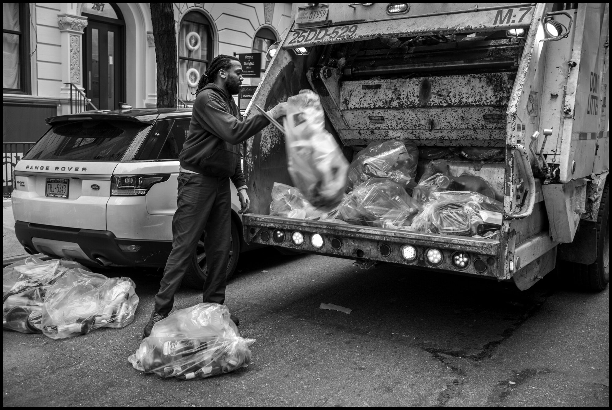  Kevin, 35, works as a garbage collector-another of the many unsung heroes of this moment.   March 28, 2020. © Peter Turnley.   ID# 06-006 