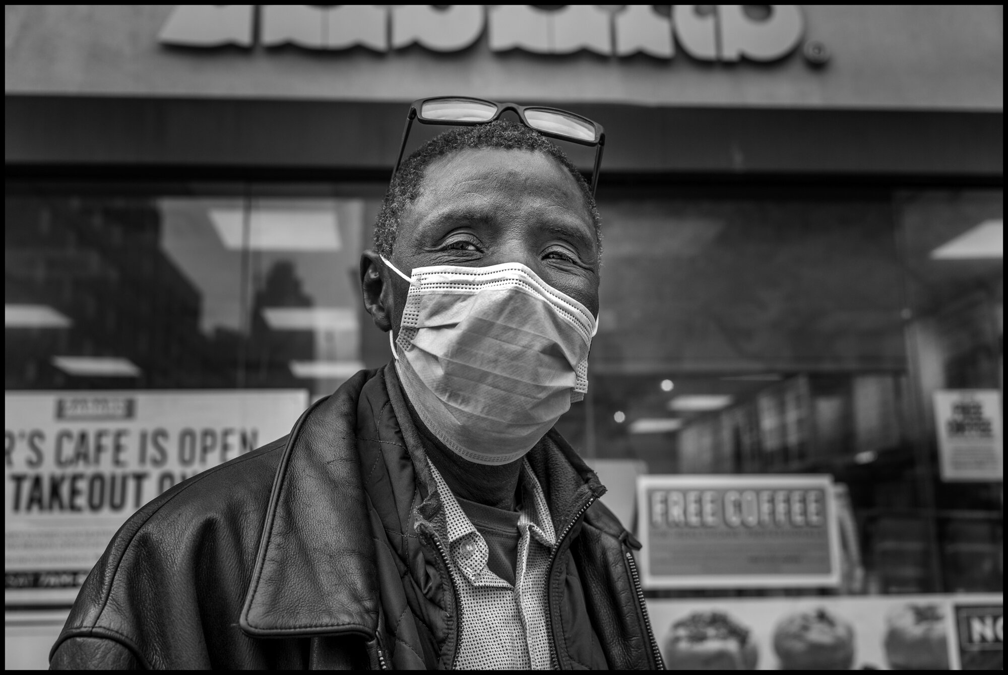  Sy, originally from Senegal, waits to shop at Zaybars on he Upper Westside.   March 31, 2020. © Peter Turnley.   ID# 09-007 