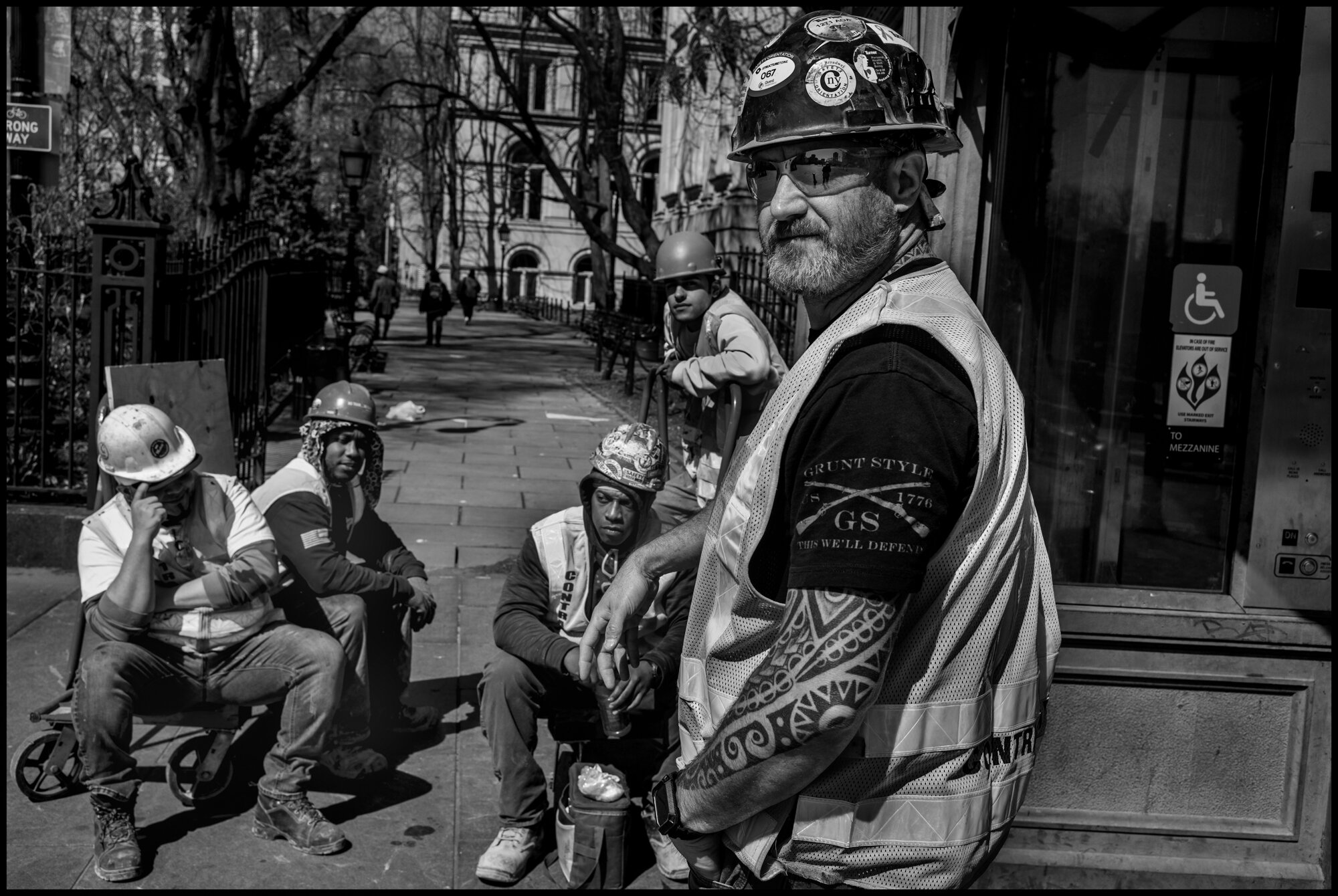  Eric, 50, stands with his fellow colleagues that are all subcontractors working New York’s MTA. They told me that they have not stopped working during this lockdown.   March 26, 2020 © Peter Turnley.   ID# 04-011 