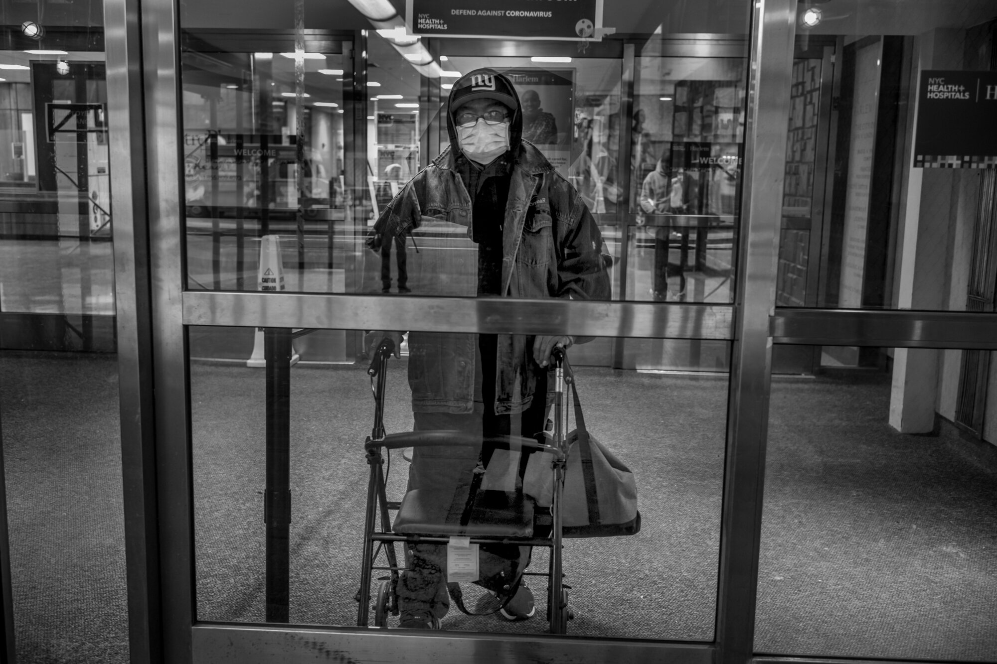  Lee, 67, stands in the doorway of Harlem Hospital where he has had session of dialysis. He told me, “my kidneys are shot and I require 3 dialysis sessions a week. He lives in Spanish Harlem. During this time of coronavirus crisis, it is easy to forg