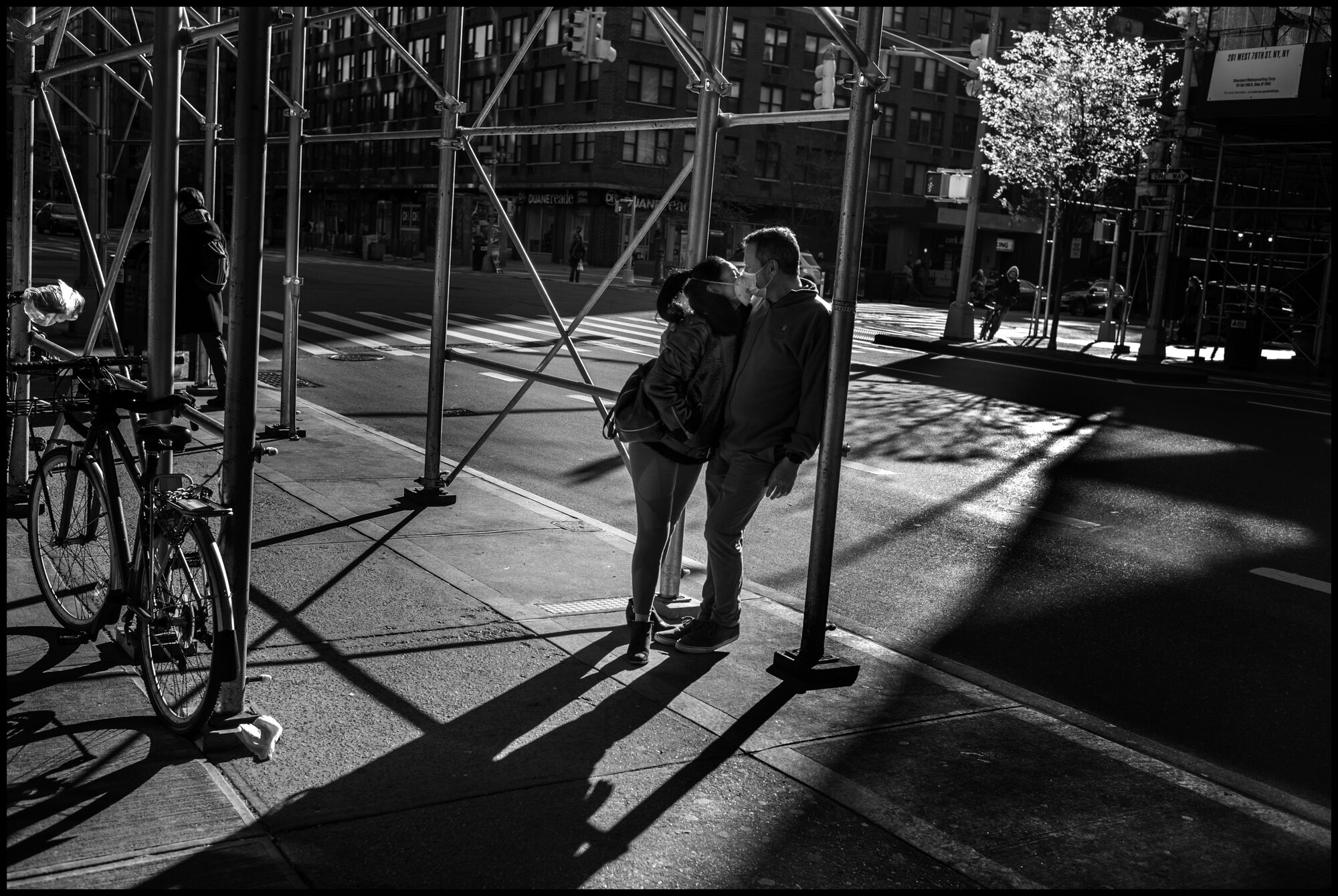  Today I went out to buy some groceries and as I turned a corner near where I stay-I saw out of the corner of my eye-a couple both wearing masks-touching each others faces as if they we're kissing. As I lifted my camera they pulled a bit apart, and I