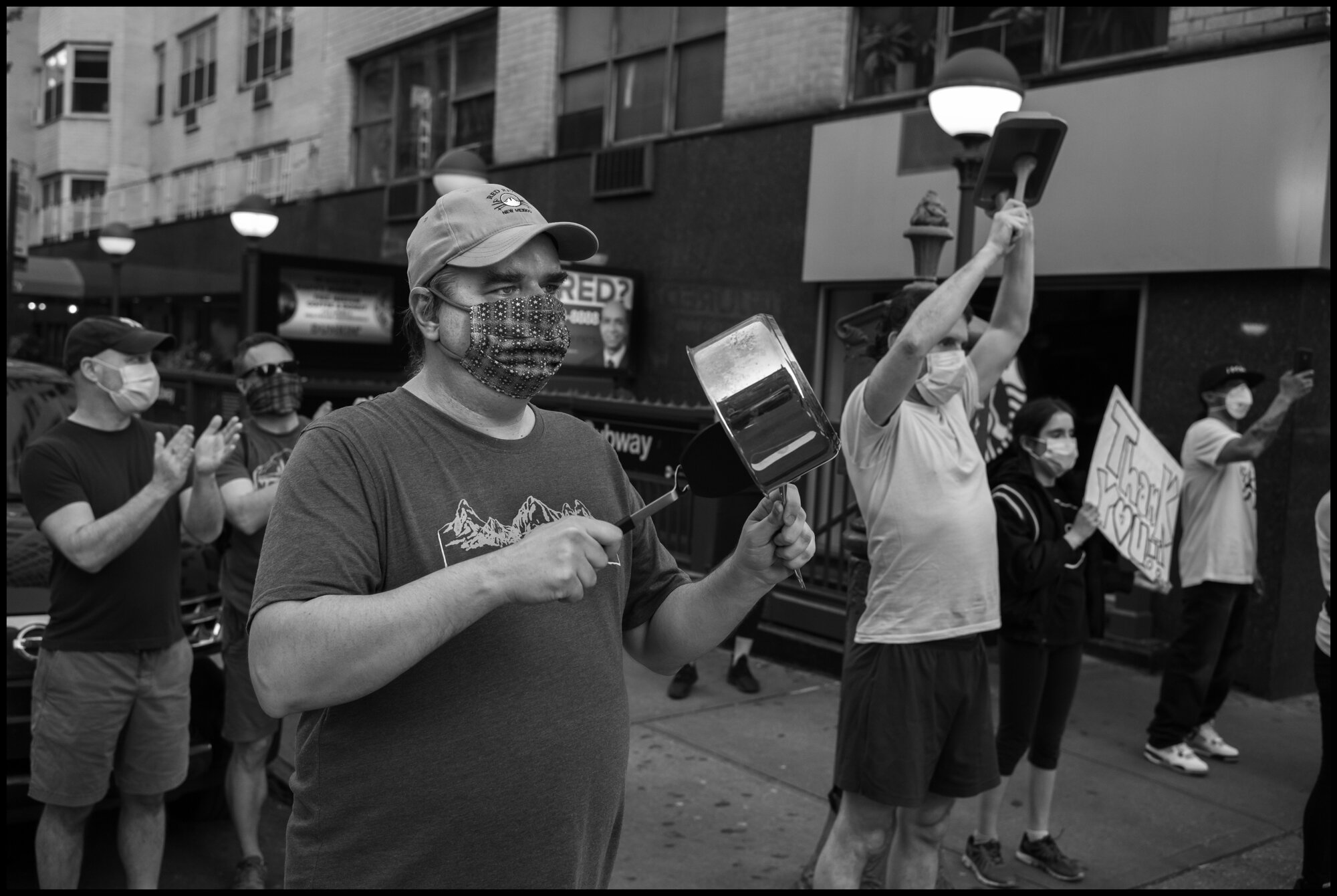  Residents of New York’s Upper East Side at 7pm.   May 2, 2020. © Peter Turnley.   ID# 36-014 