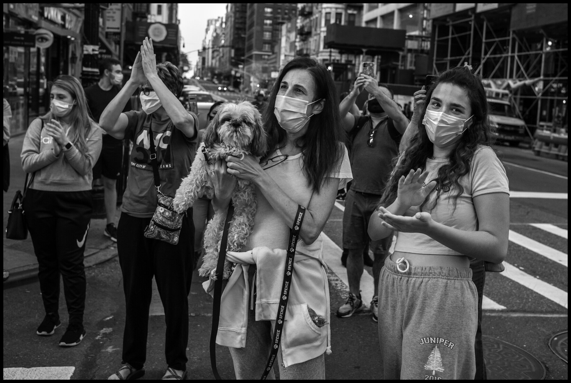  Residents of New York’s Upper East Side at 7pm.   May 3, 2020. © Peter Turnley.   ID# 36-019 