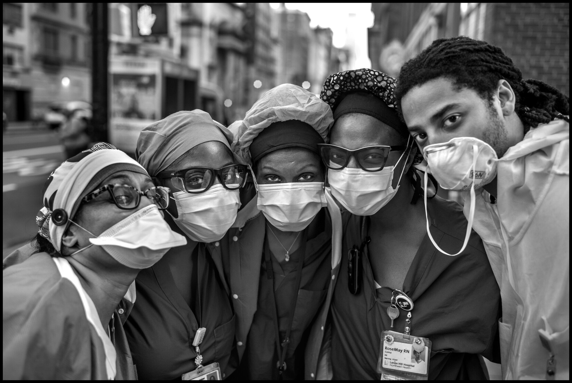  A group of ICU nurses from Lenox Hill Hospital on New York’s Upper East Siide. Sean, 30, on the right, told me, “diversity and unity. There is strenght the in diversity and unity . We are a team and have to stay together.”   May 3, 2020. © Peter Tur