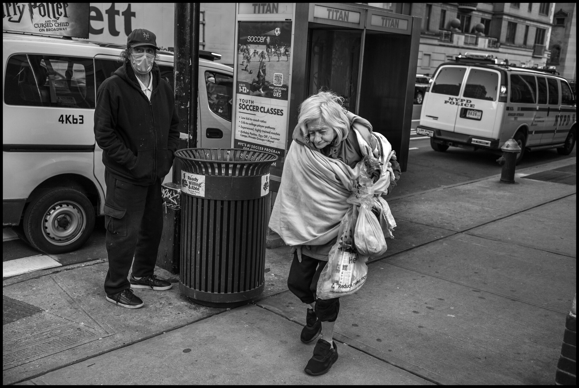  On Friday night, after photographing what has become a 7pm ritual of people coming outside to applaud and cheer and thank the healthcare and essential workers in front of Lenox Hill Hospital in New York—I encountered Nini—walking with bags of posses