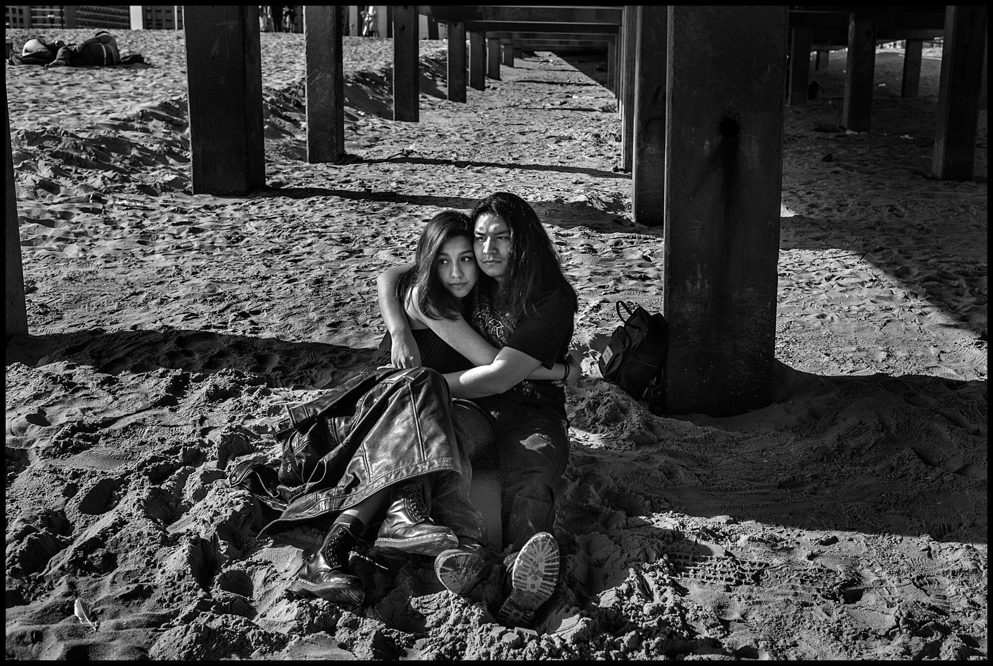  Daniel, 20 and Melissa, 18, met for the first time only shortly before the quarantine began. This was their first date in person. Coney Island, New York.  May 16, 2020. © Peter Turnley.  ID# 49-002 