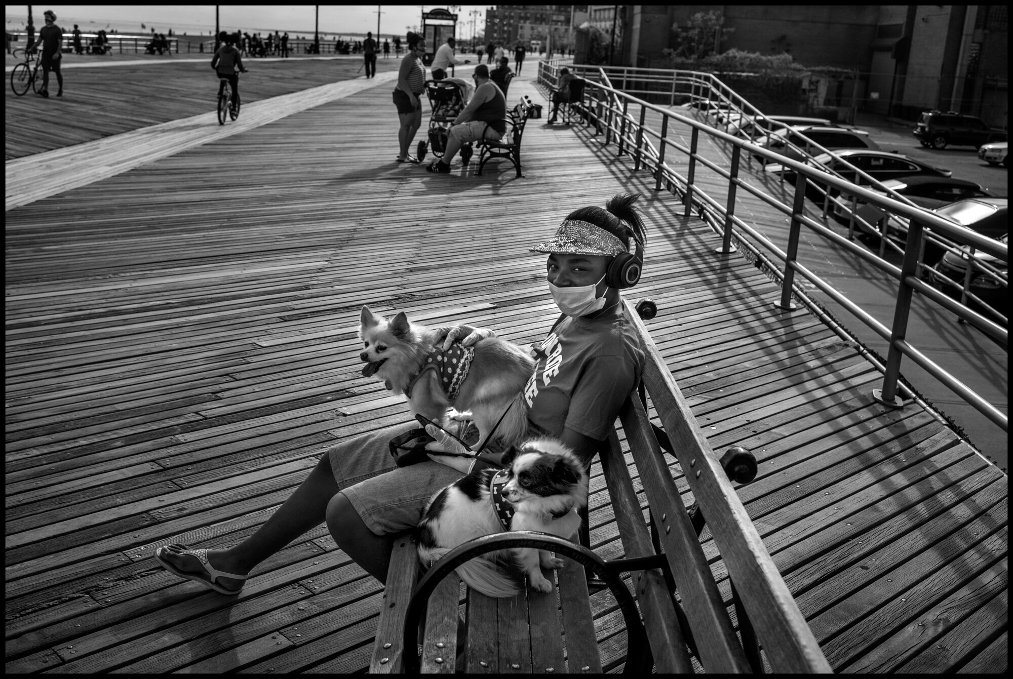  Dayneanda and her dogs, Asher and Archie. Coney Island, New York.  May 16, 2020. © Peter Turnley.  ID# 49-011 