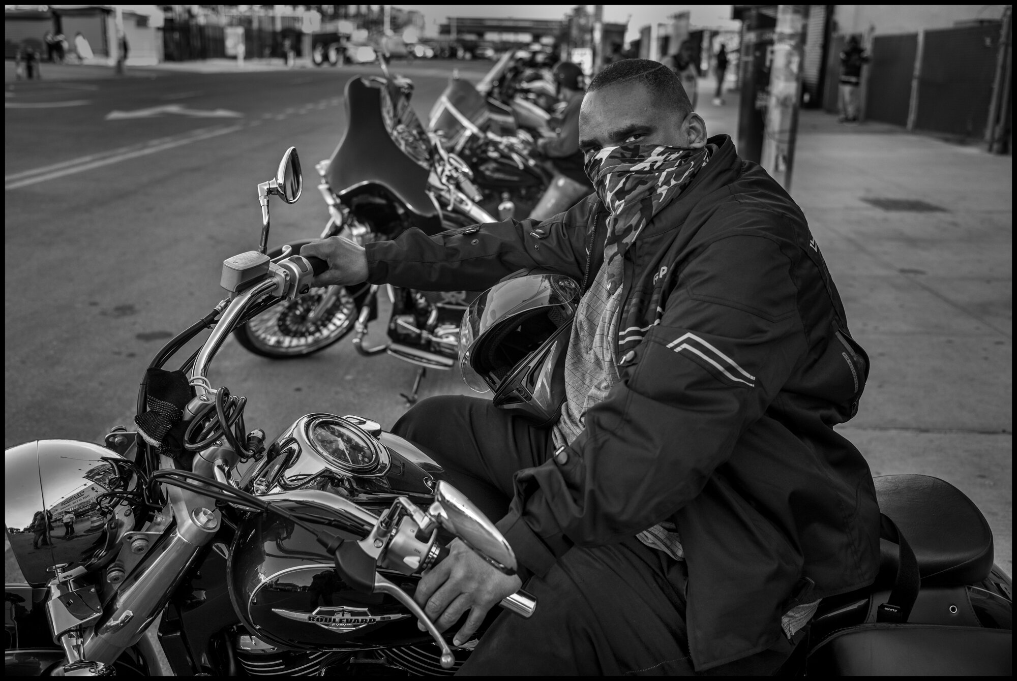  Simon on his motorcycle.Coney Island, New York.  May 16, 2020. © Peter Turnley.  ID# 49-019 