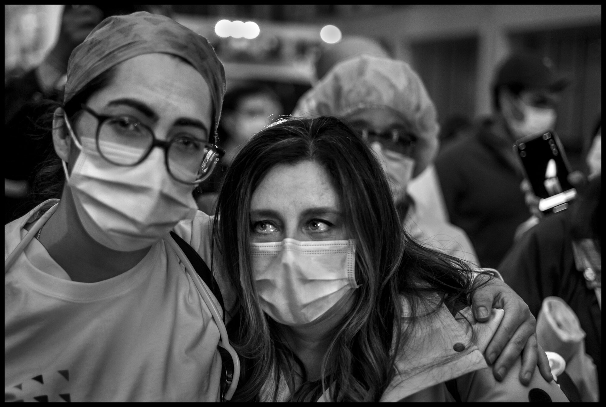  Frontline workers from Lenox Hill Hospital, New York, hold vigil to honor all victims of COVID-19.  May 20, 2020. © Peter Turnley.   ID# 51-002 
