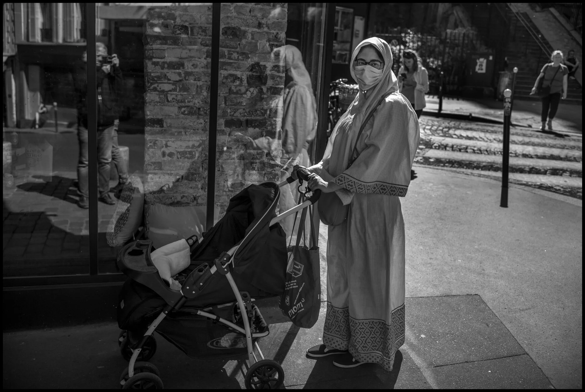  Senad, 28, with her 4 month old baby. Near metro Chateau Rouge,   Paris.May 26, 2020. © Peter Turnley.  ID# P04-026 