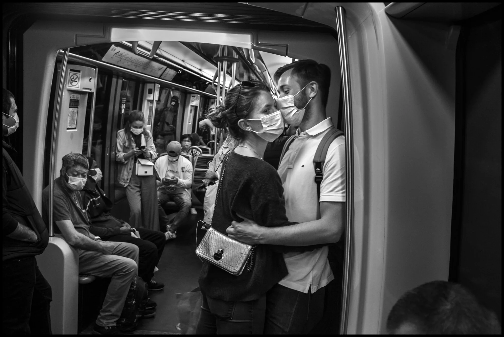  Emma, 20, and Elie, 24, ride the subway. Paris.  May 25, 2020. © Peter Turnley.  ID# P02-002 