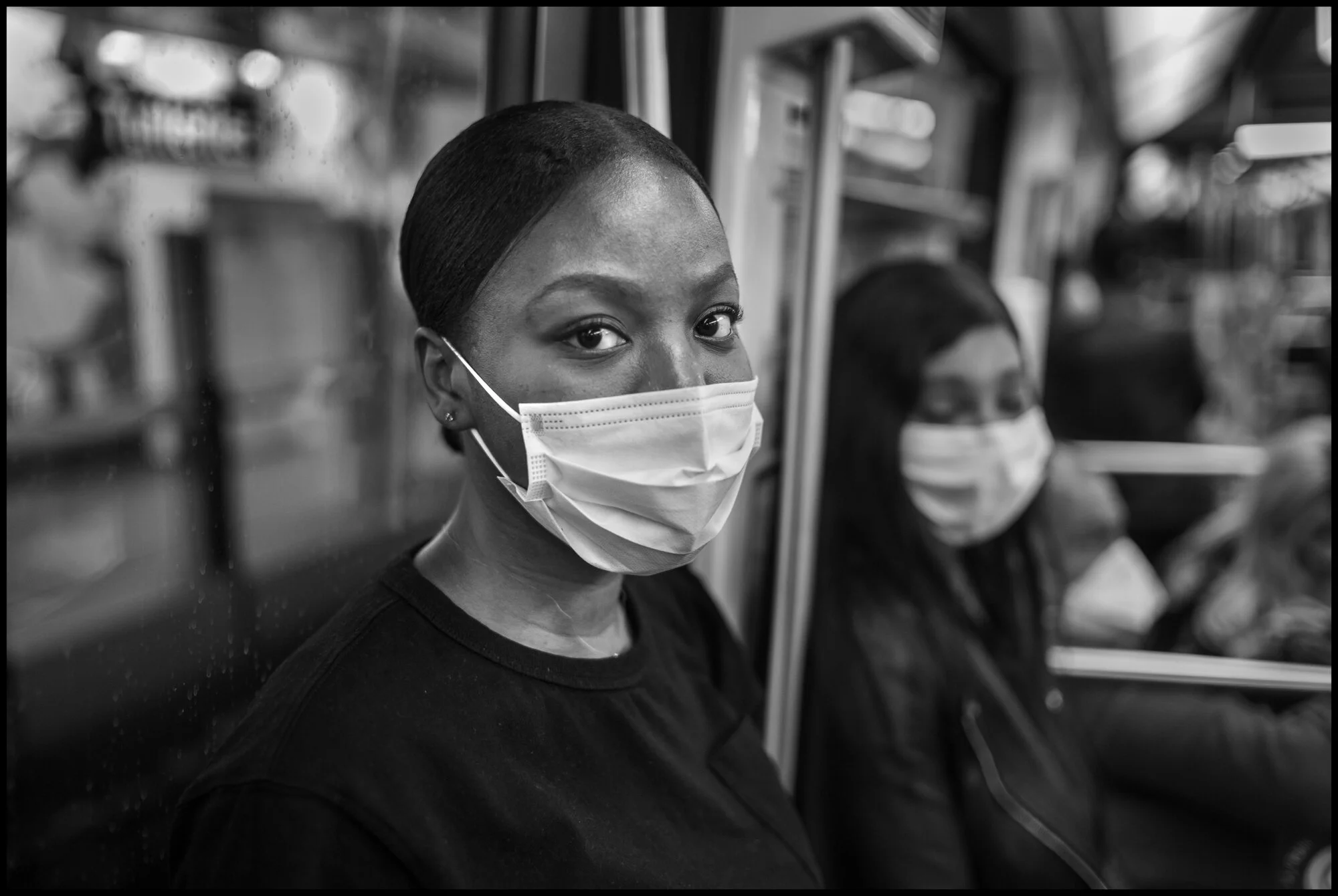  Gisèle, and Eva, Paris subway. Paris.  May 25, 2020. © Peter Turnley.  ID# P02-005 