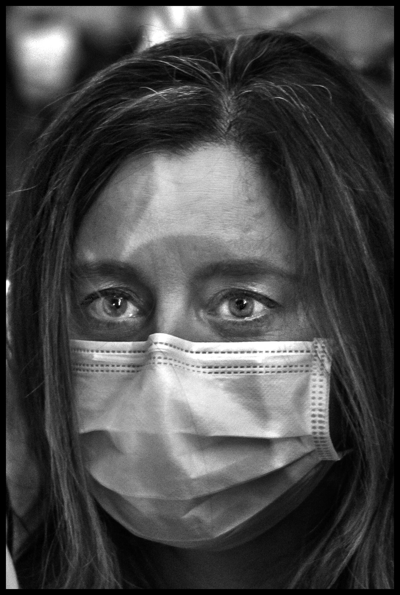  Frontline worker from Lenox Hill Hospital, New York, participates in a vigil to honor all victims of COVID-19.  May 20, 2020 © Peter Turnley.  ID# 53-001 