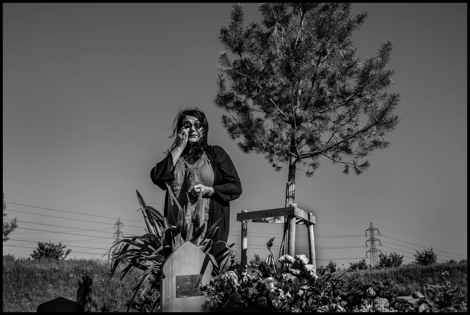  Zakia, 56, mourning her brother, Arezki Ammi. St. Denis, France.   May 29, 2020. © Peter Turnley.  ID# P08- 004 