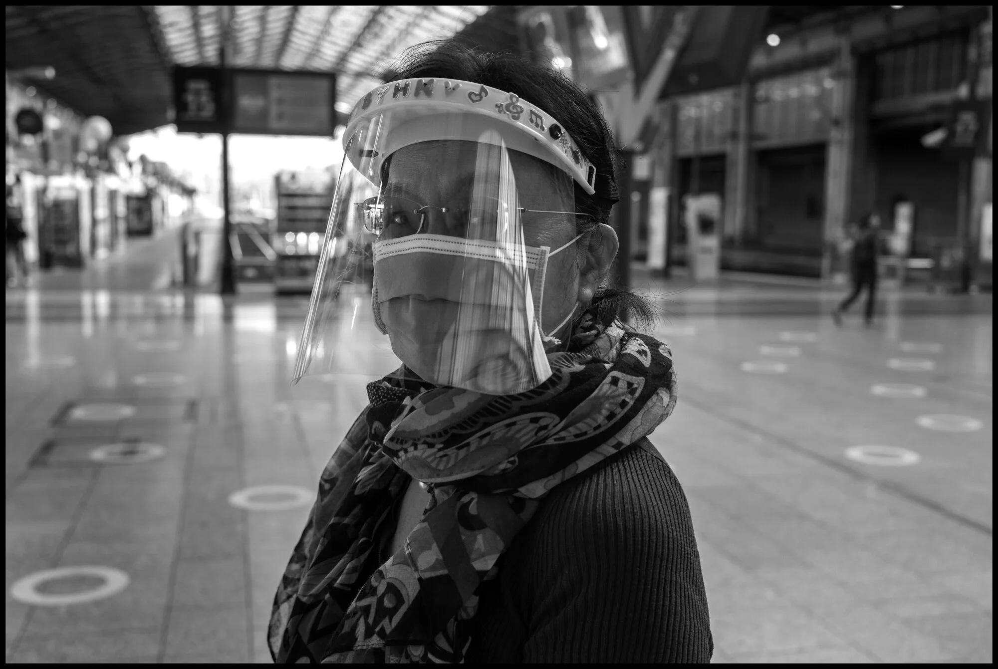  Pun, from Hong Kong, now living in France, prepares to take a train at La Gare du Nord Train Station, Paris.   May 28, 2020. © Peter Turnley.  ID# P07-016 