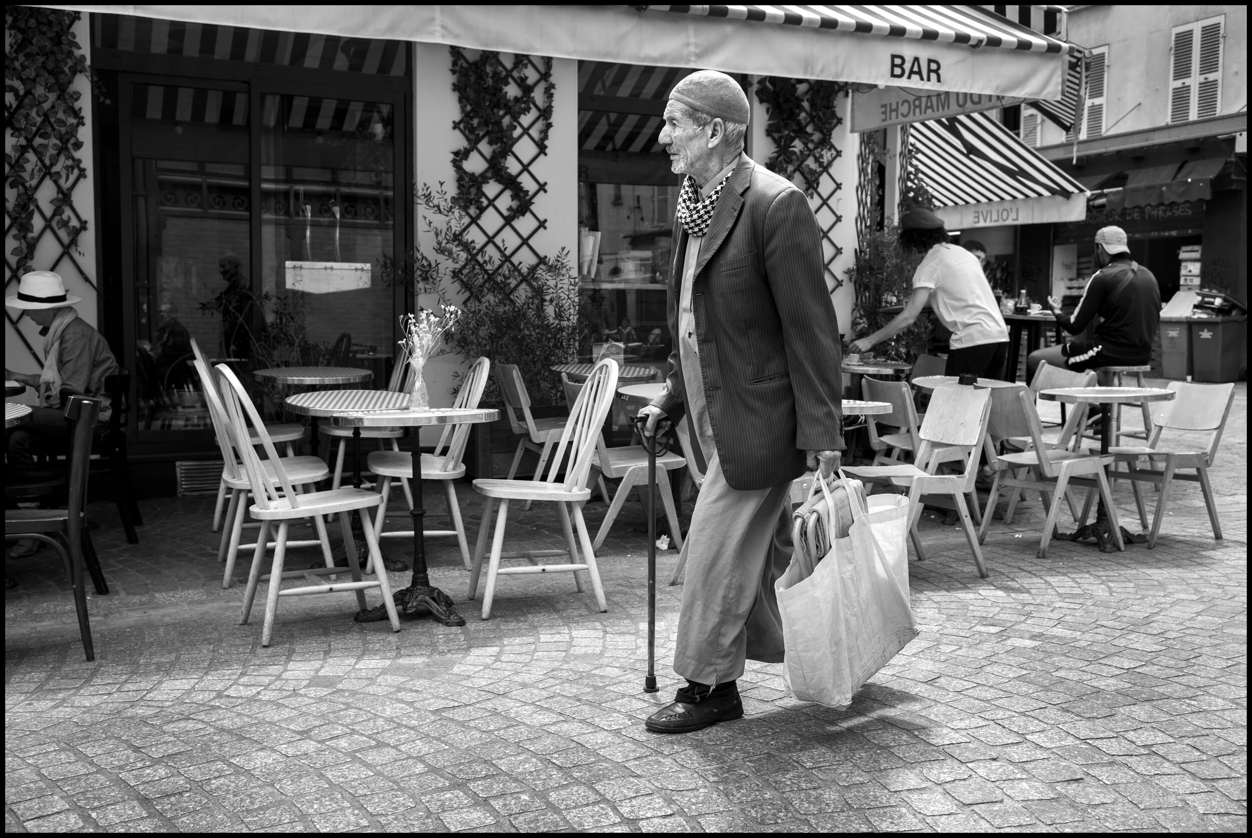  Nellia, living in Paris, waits for her train, Gare du Nord, Paris.  June 29, 2020. © Peter Turnley.   ID# P47-012 