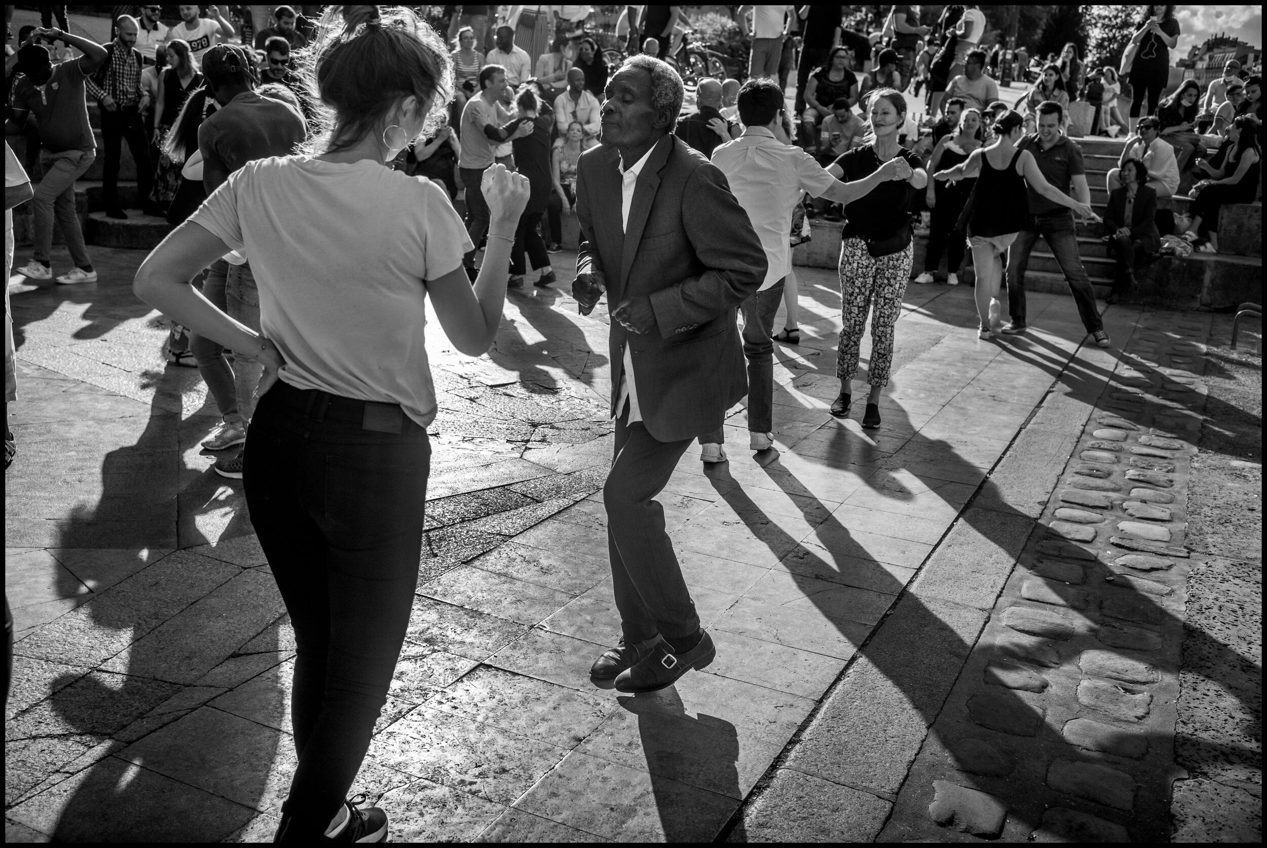  Mamour, 70, dancing salsa with Claire, Paris.  June 28, 2020. © Peter Turnley.   ID# P46-020 