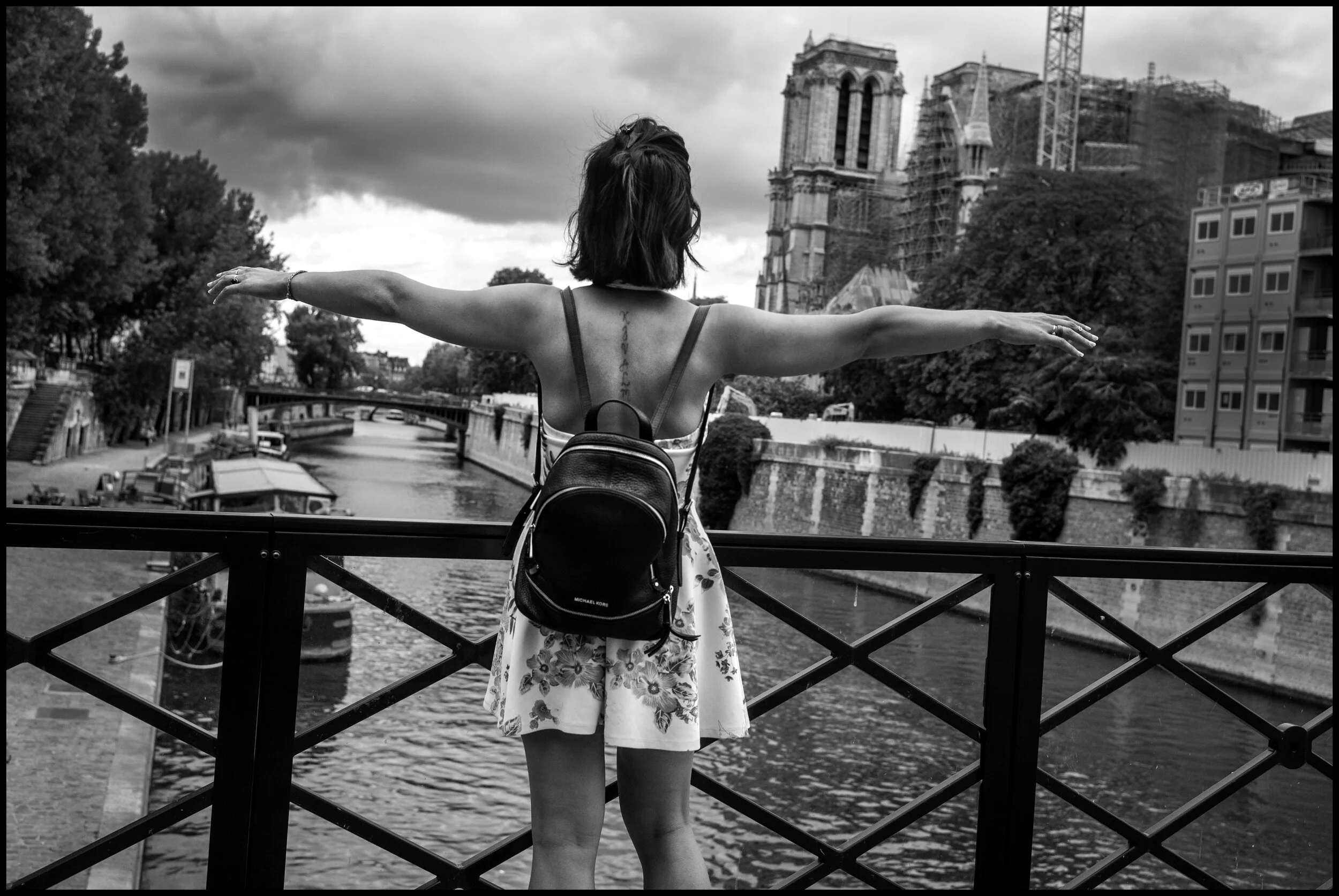  Hoxha, 29, originally from Tirania, Albania, behind Notre Dame Cathedral.   June 28, 2020. © Peter Turnley.   ID# P46-25 