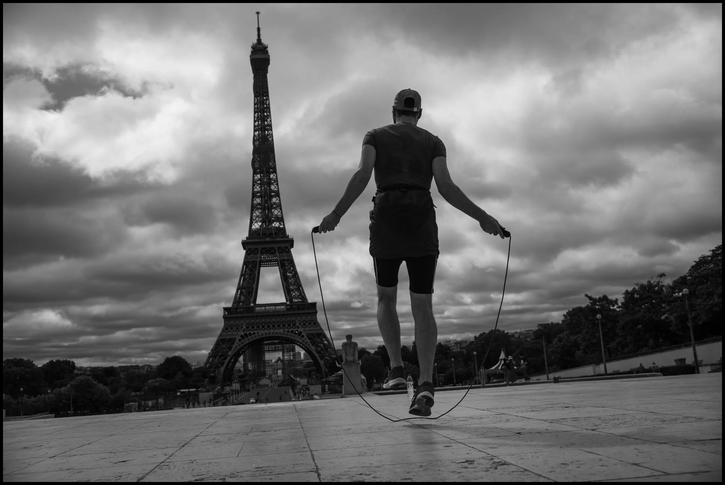  Akef, is originally from Afghanistan and now works at the Eiffel Tour and often trains in the morning jumping rope.  July 4, 2020. © Peter Turnley.  ID# P53-007 