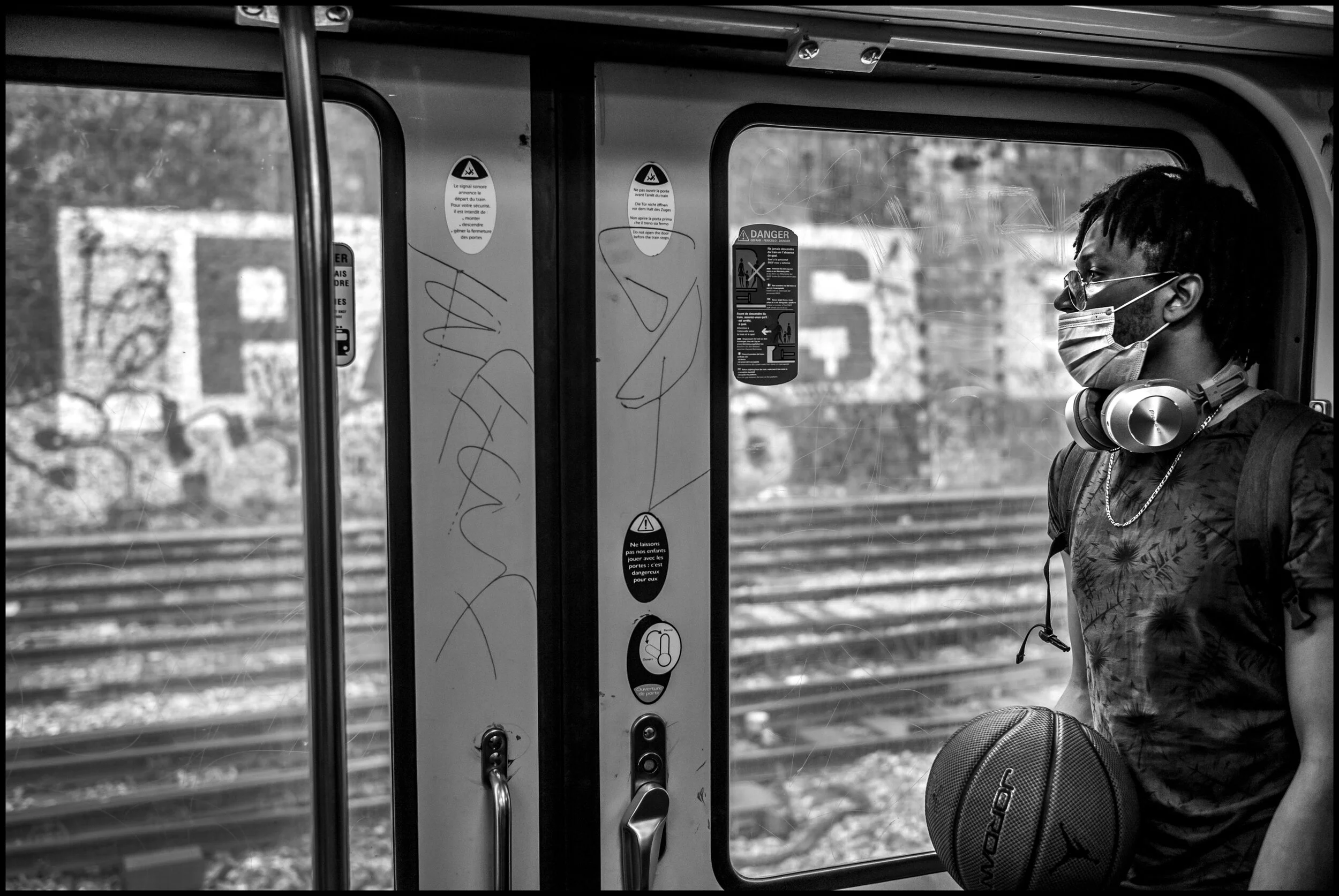  Kid Ally, a passenger on the train returning to Paris. July 11, 2020. © Peter Turnley.  ID# P59-011 