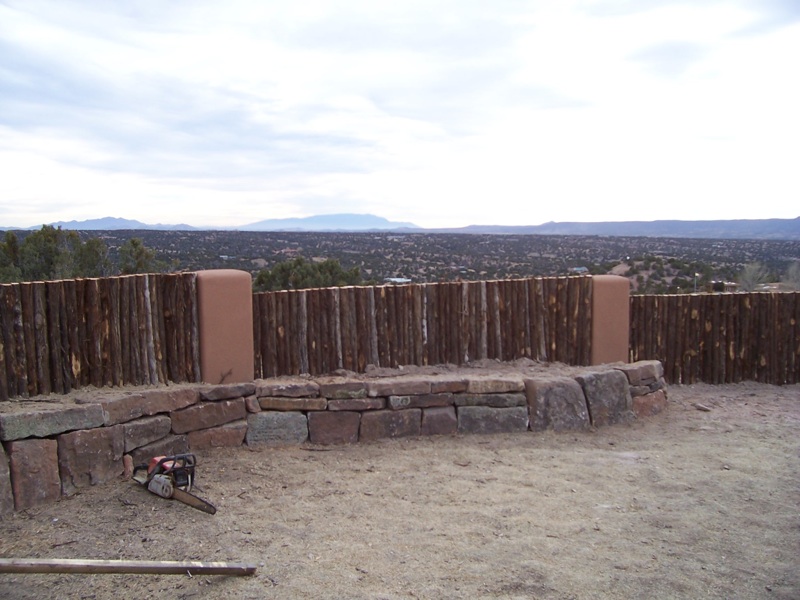  Contemporary coyote fence with stucco pillars 