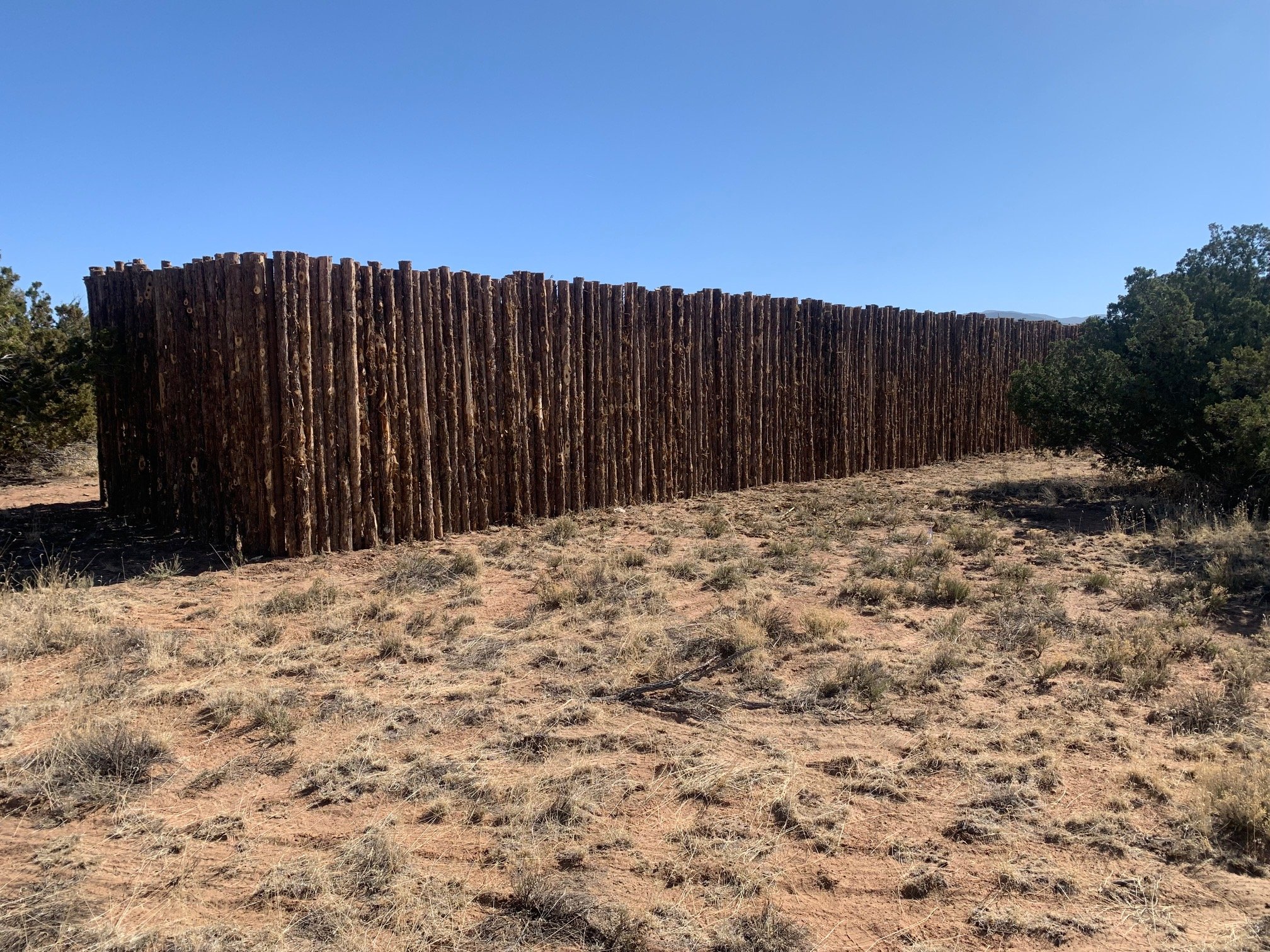  Solar array shielding coyote fence 